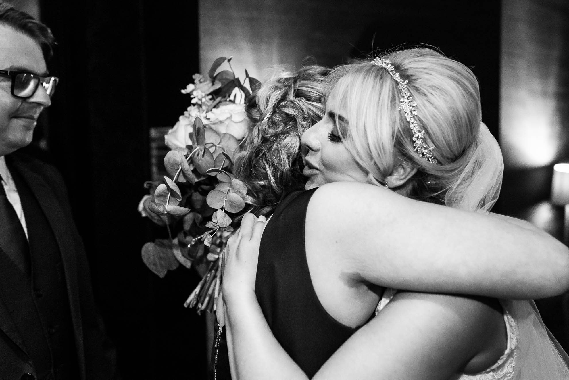 Wedding guest congratulates bride