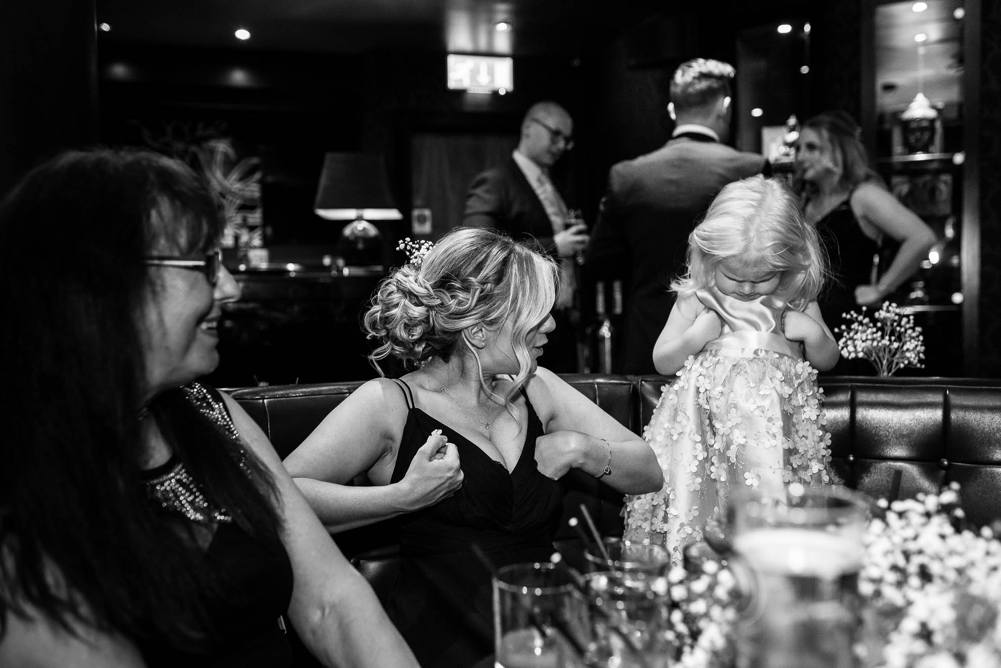 Flower girl plays with her mum