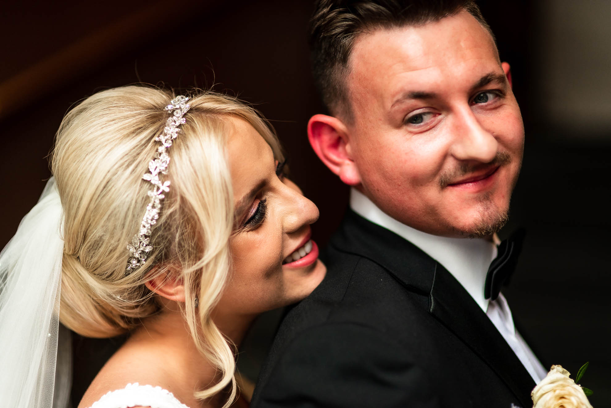 Close up portrait of bride and groom