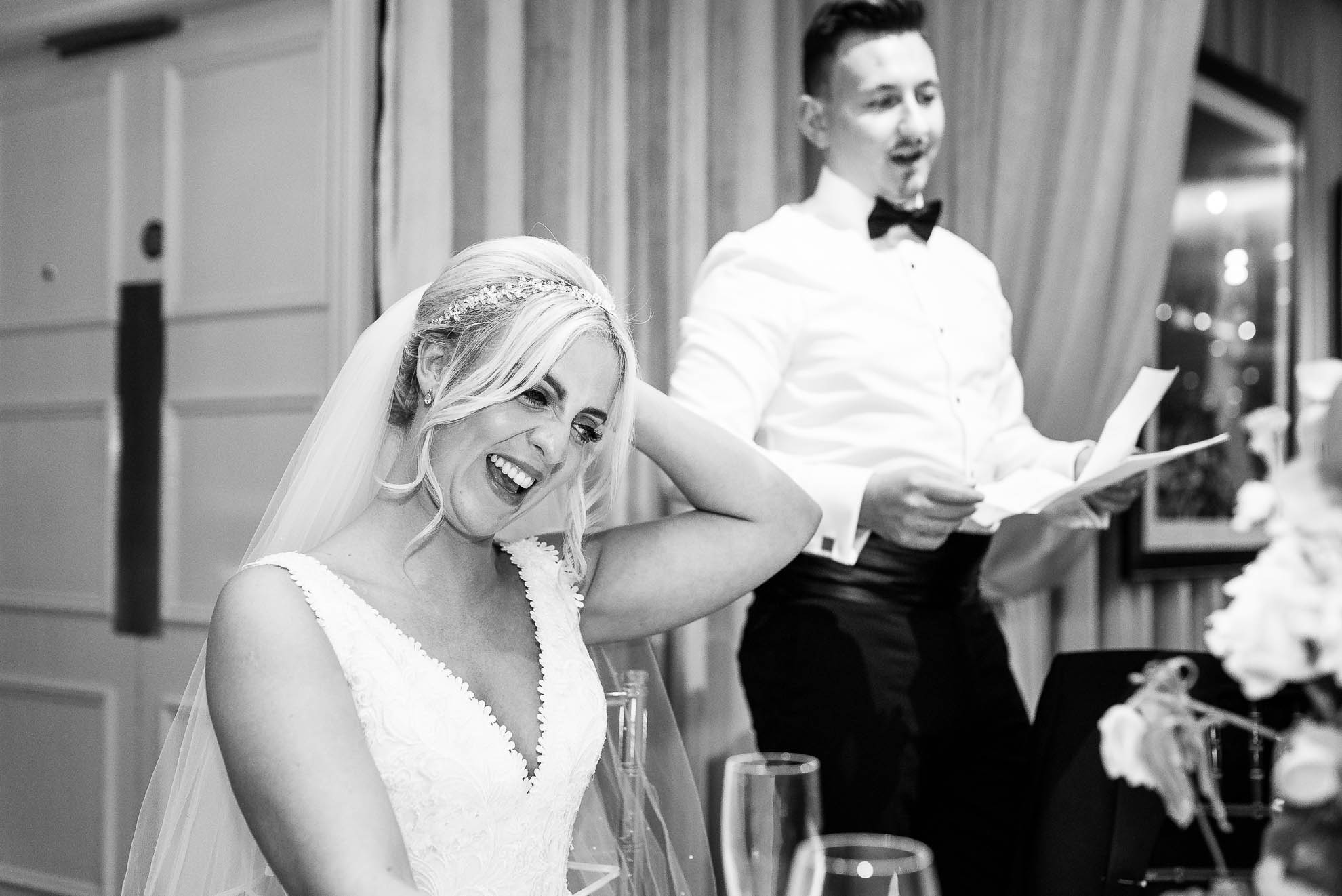 Bride laughing during the speeches