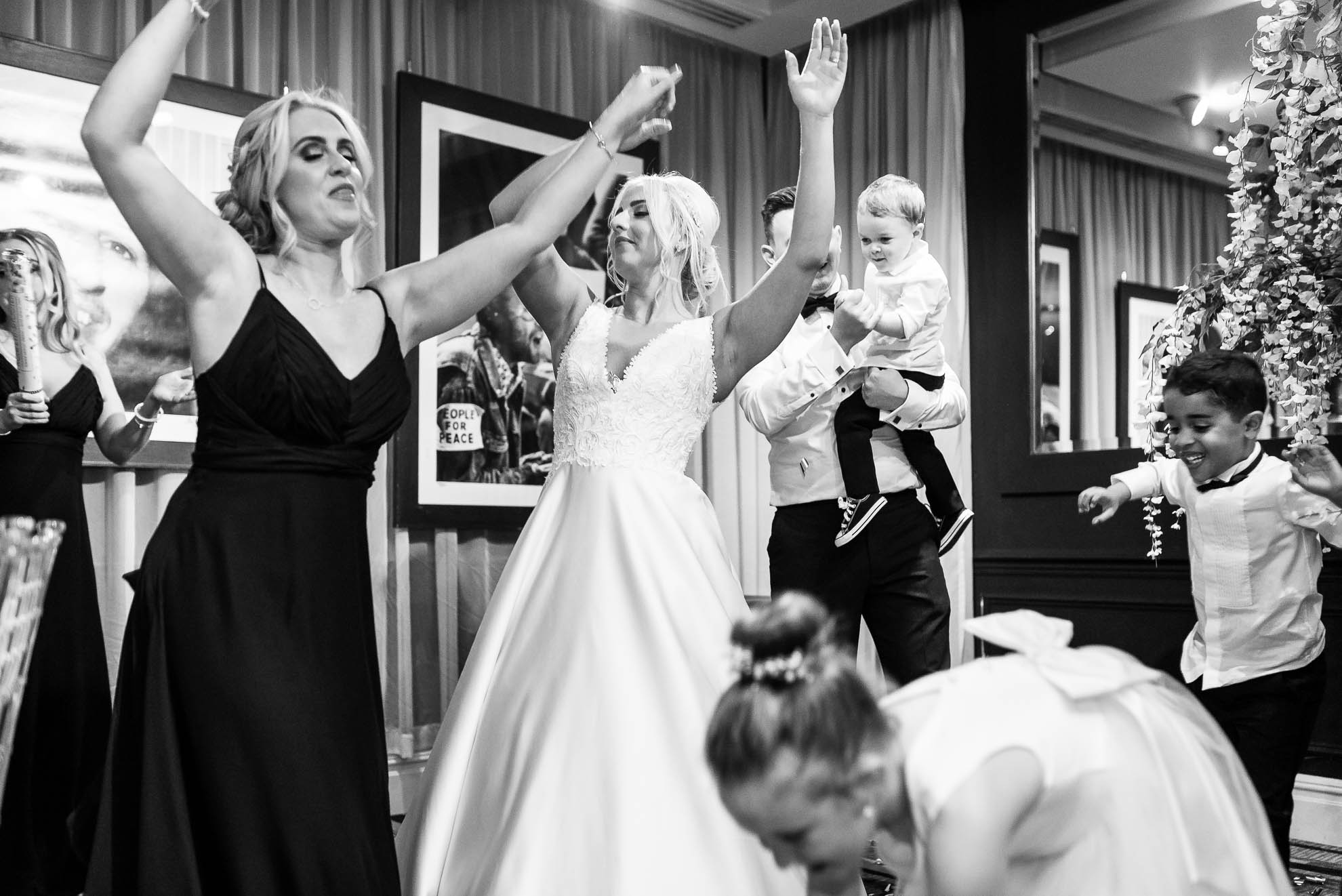 Bride dancing with bridesmaids