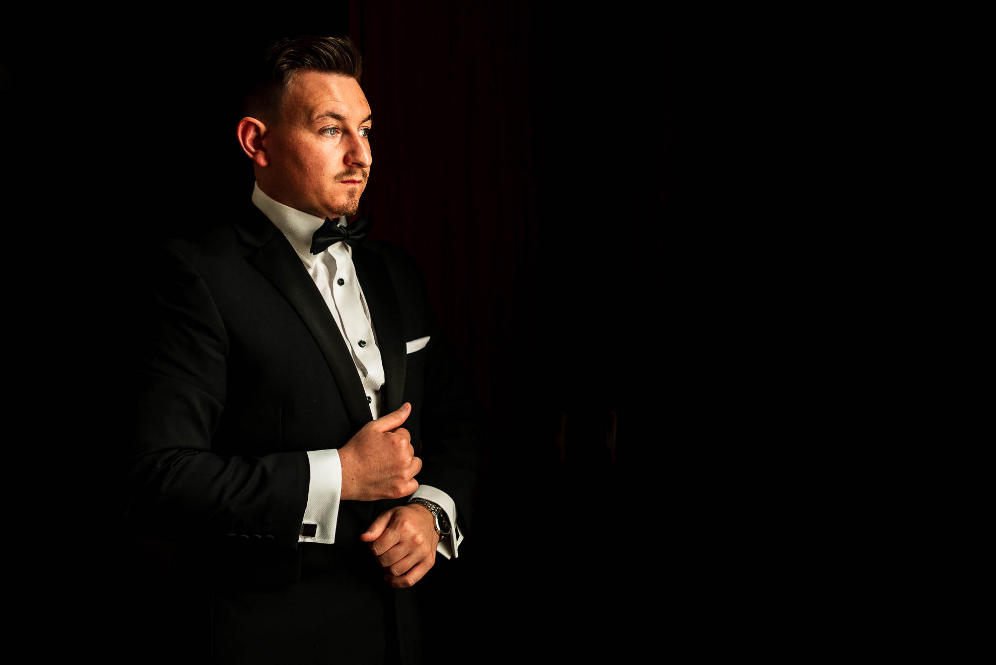 Groom puts his jacket on