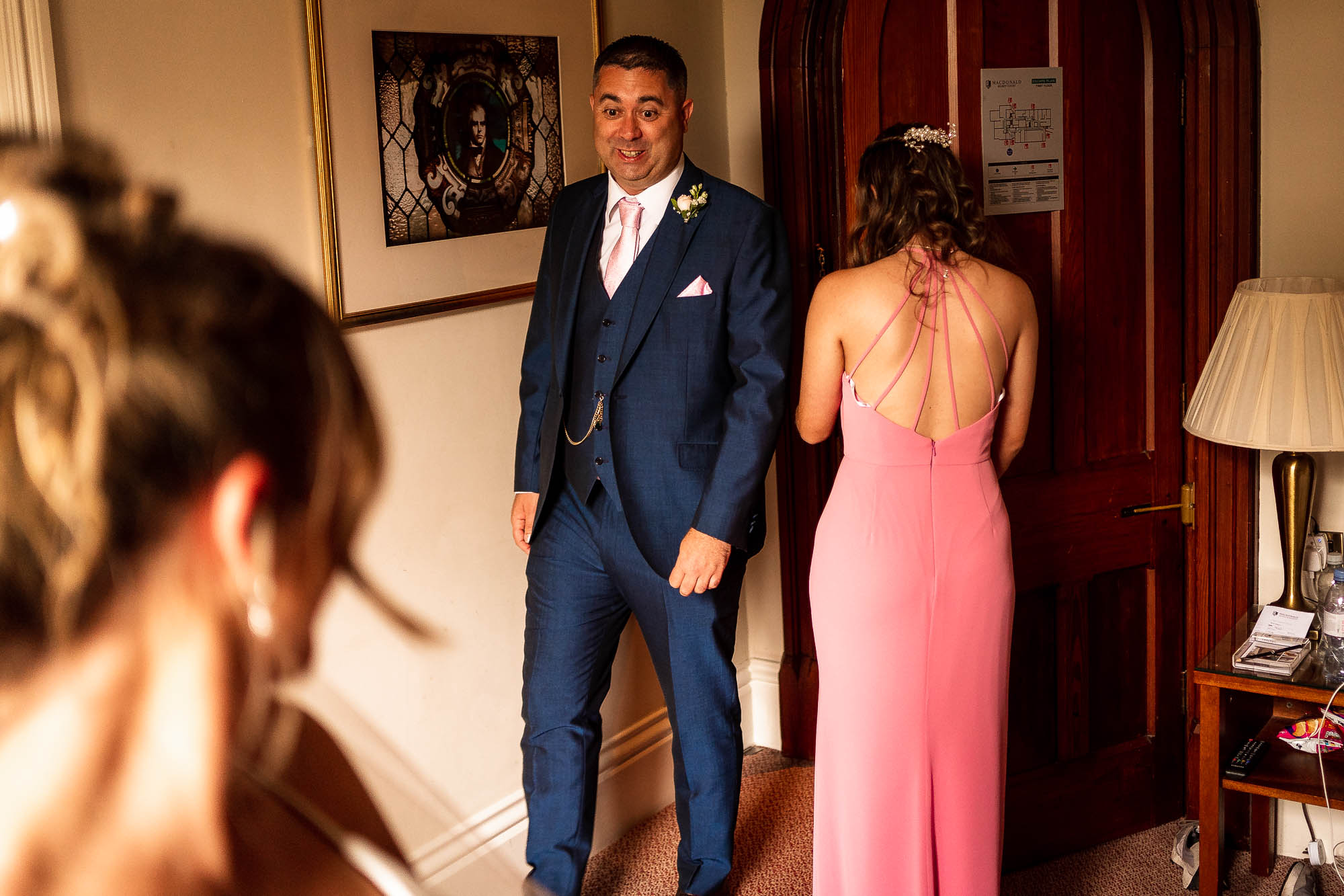 Father of the bride sees the bride in her dress for the first time