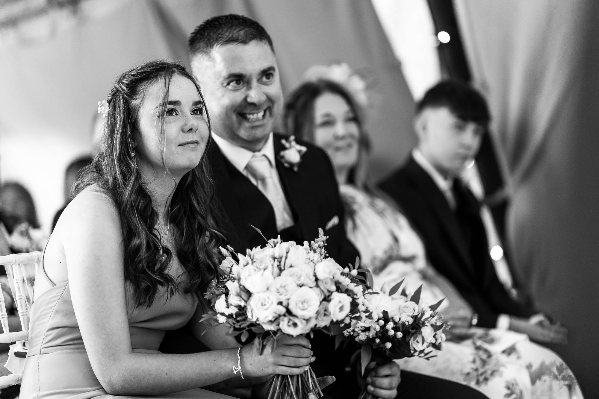 wedding guests watch the ceremony