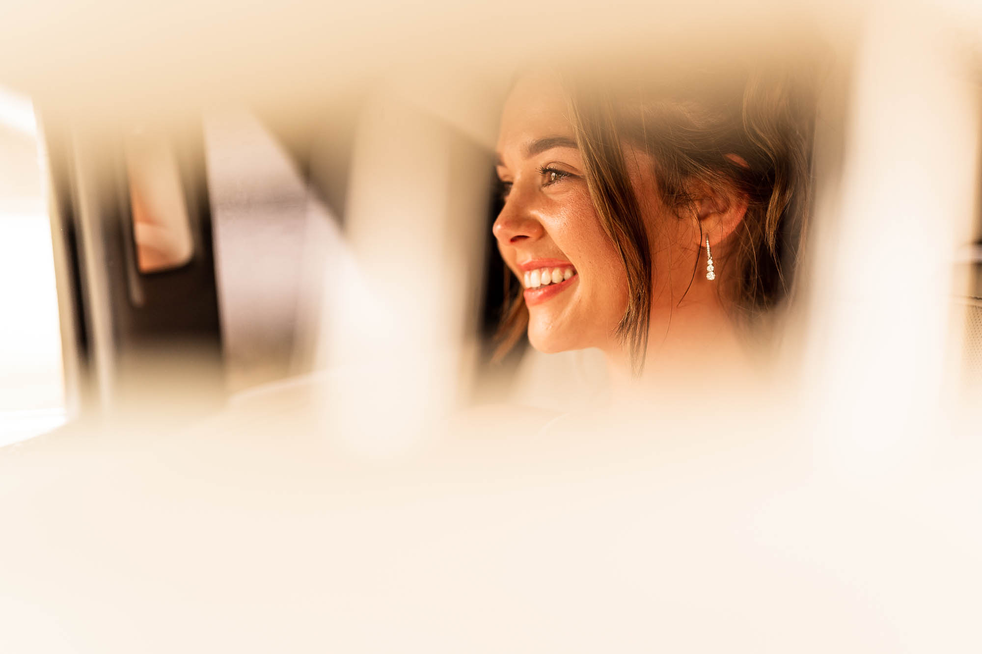 Bride in wedding car at Betty's Tipi Inglenook Farm