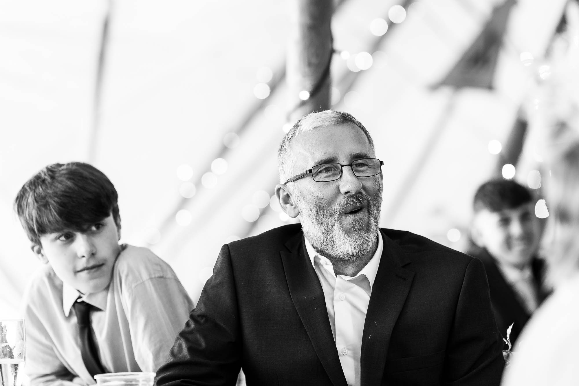 Guests laugh during speech