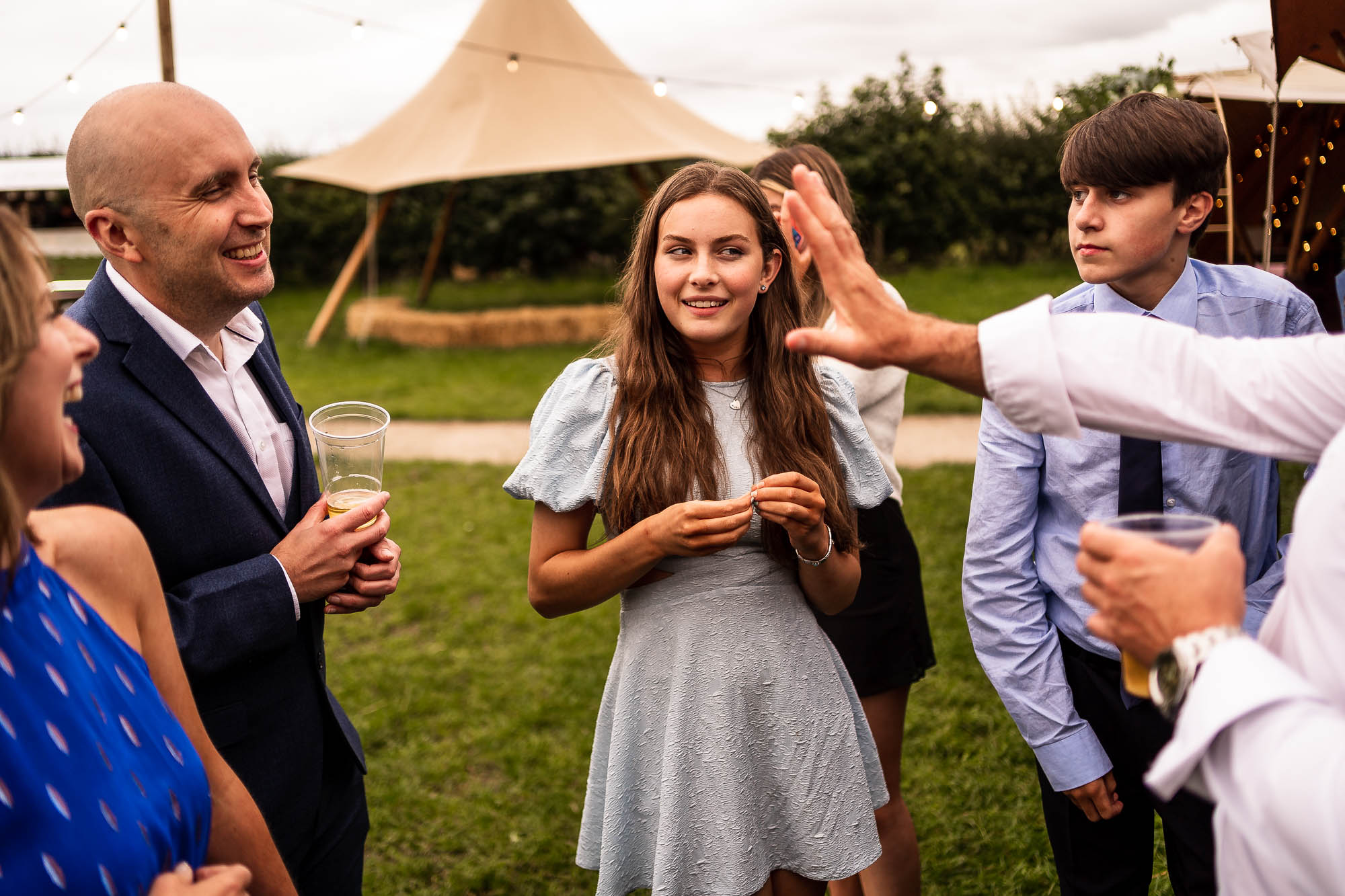 Guests sharing a joke outside Betty's Tipi Inglenook Farm