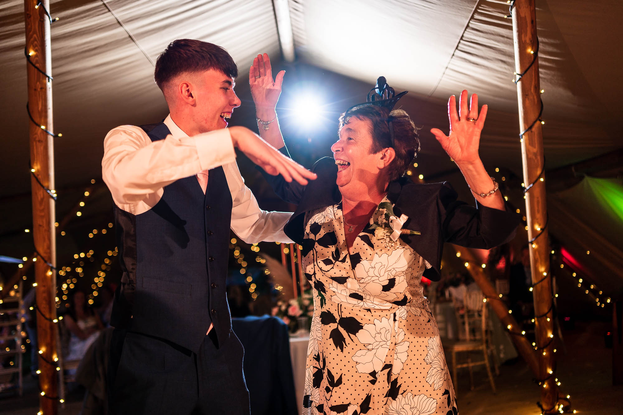 Guests share a joke as they dance