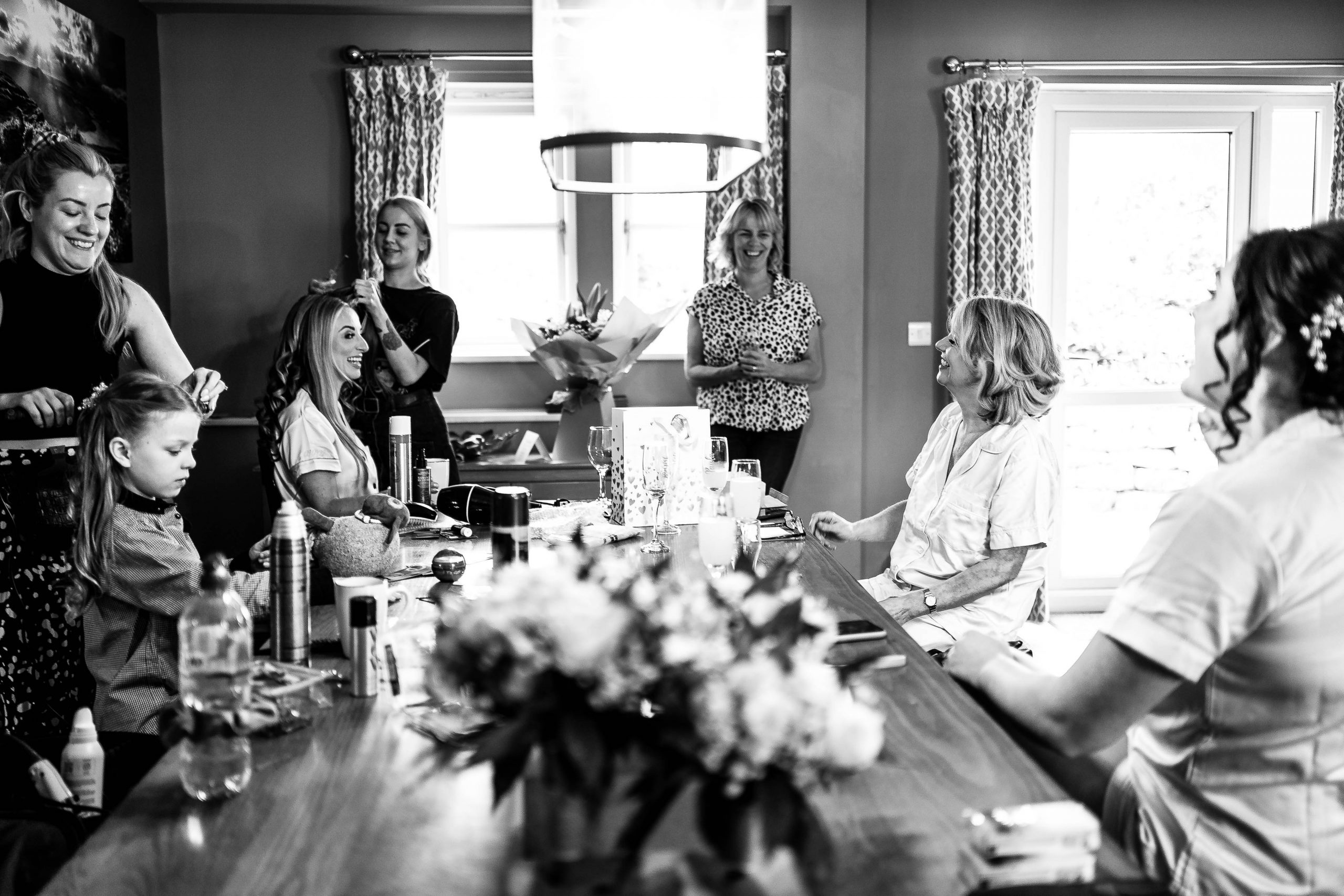 Bride shares a joke with her wedding party