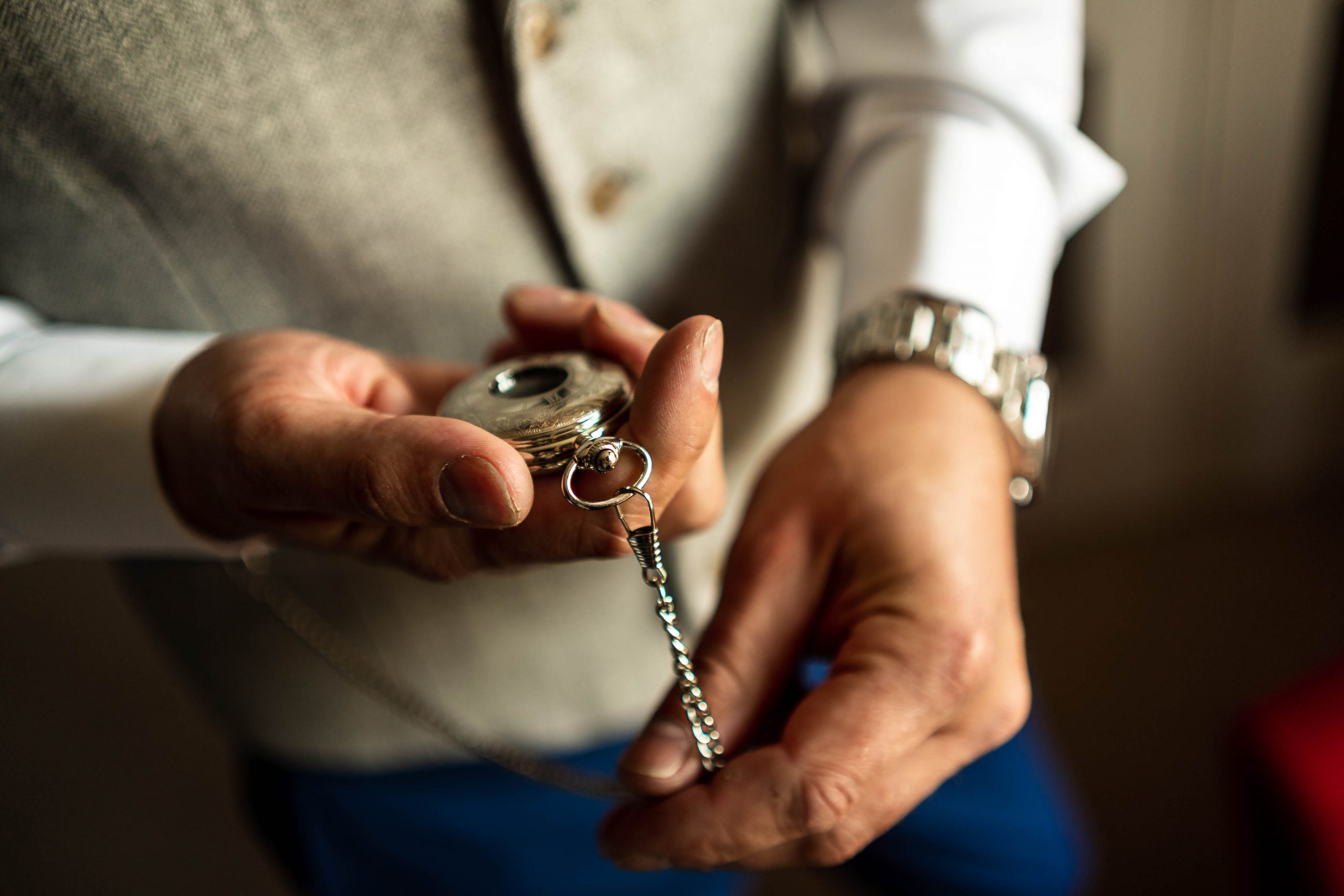 Groom looks at his pocket watch
