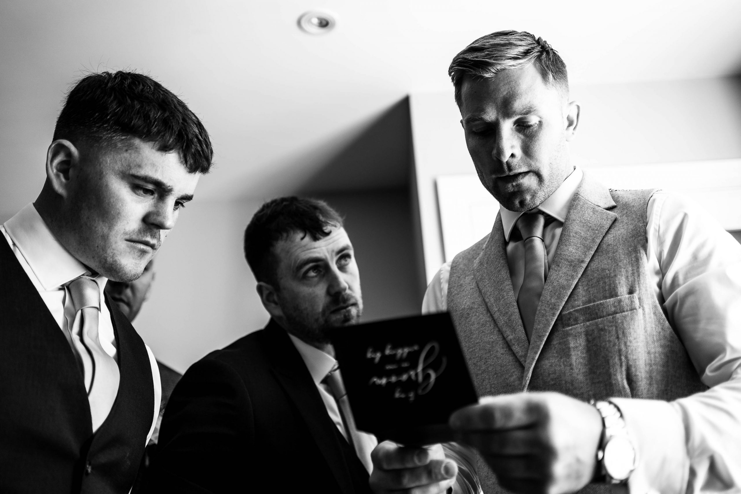 Groom reads brides card