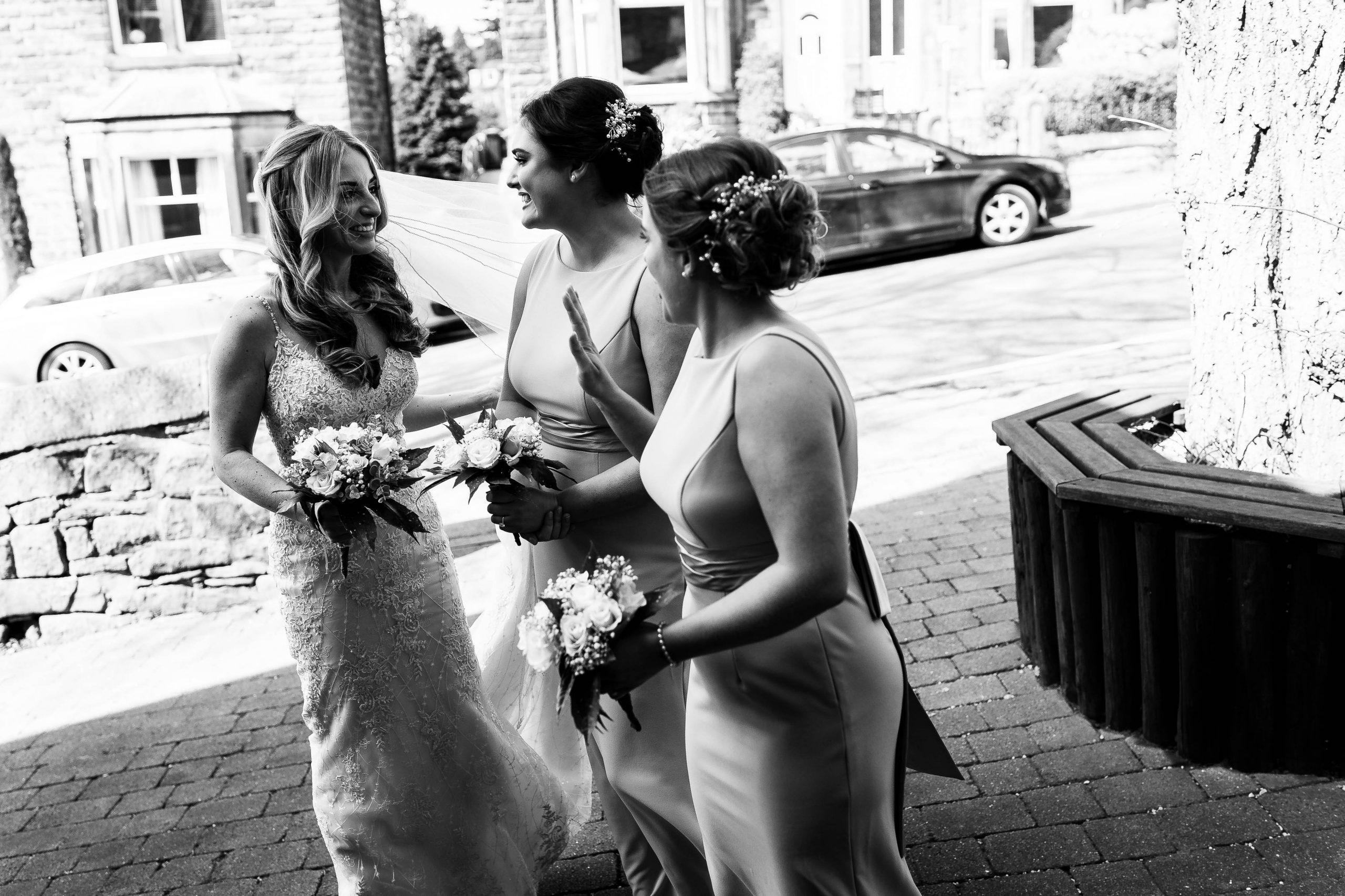 Bride with her bridesmaids outside church