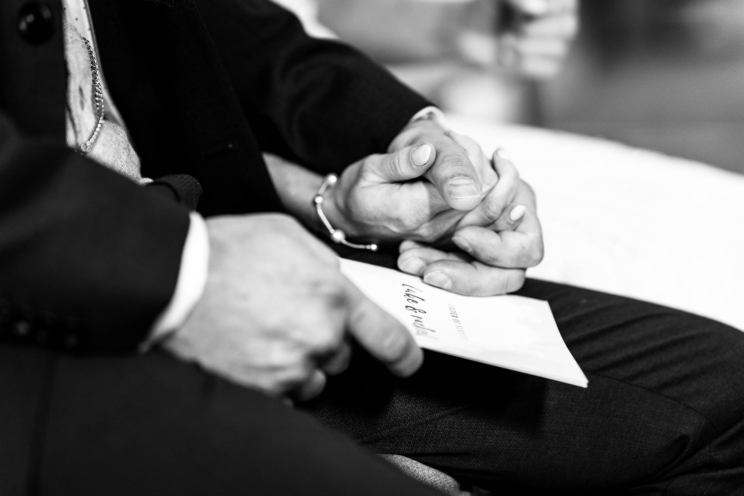 Bride and groom hold hands