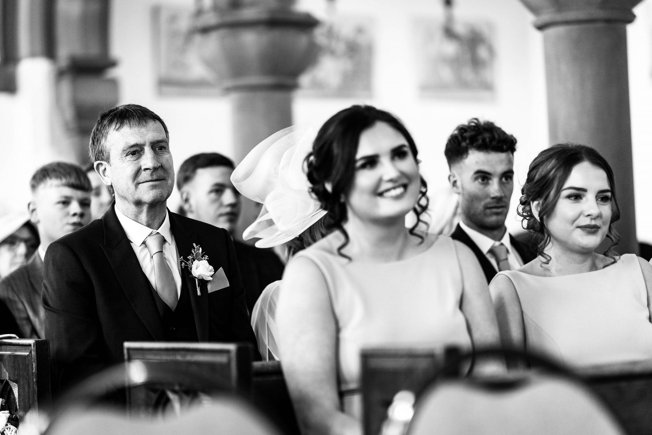 Father of the bride watches the ceremony