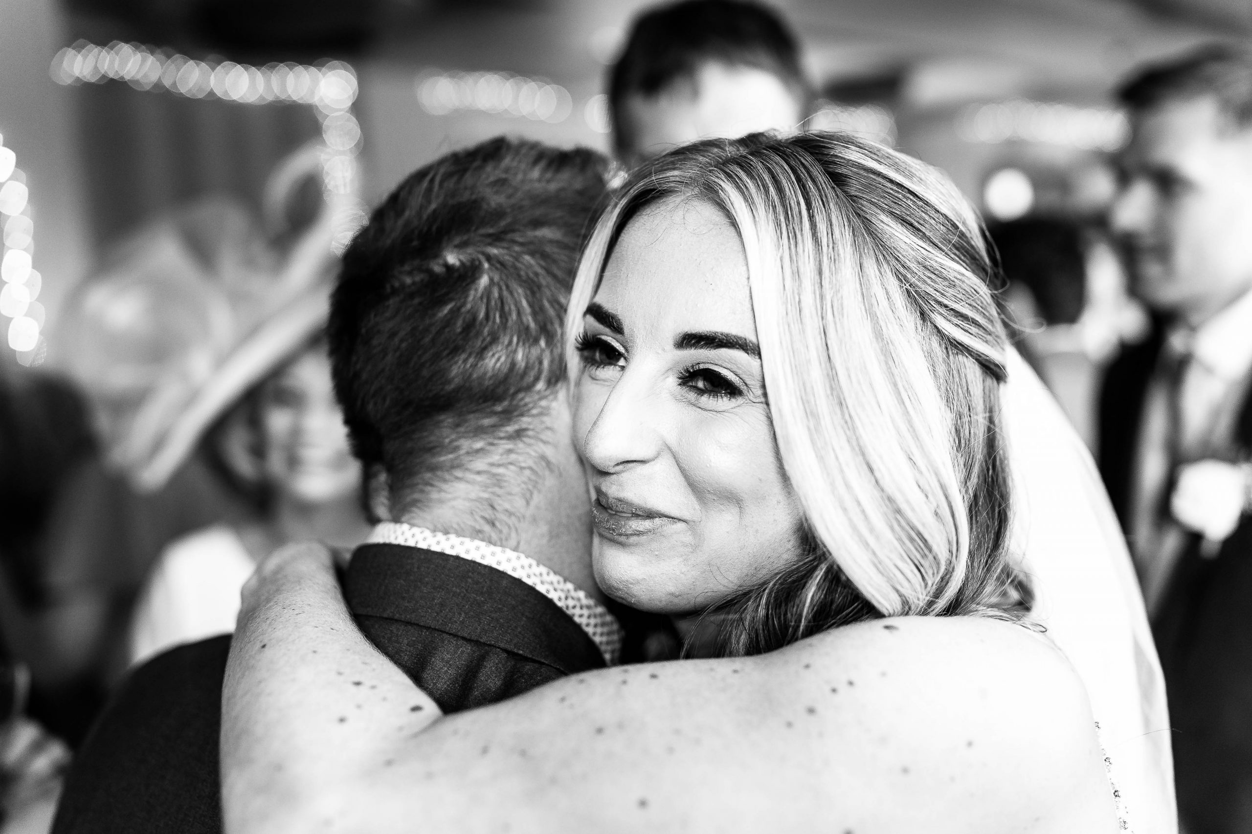 Bride hugs wedding guest