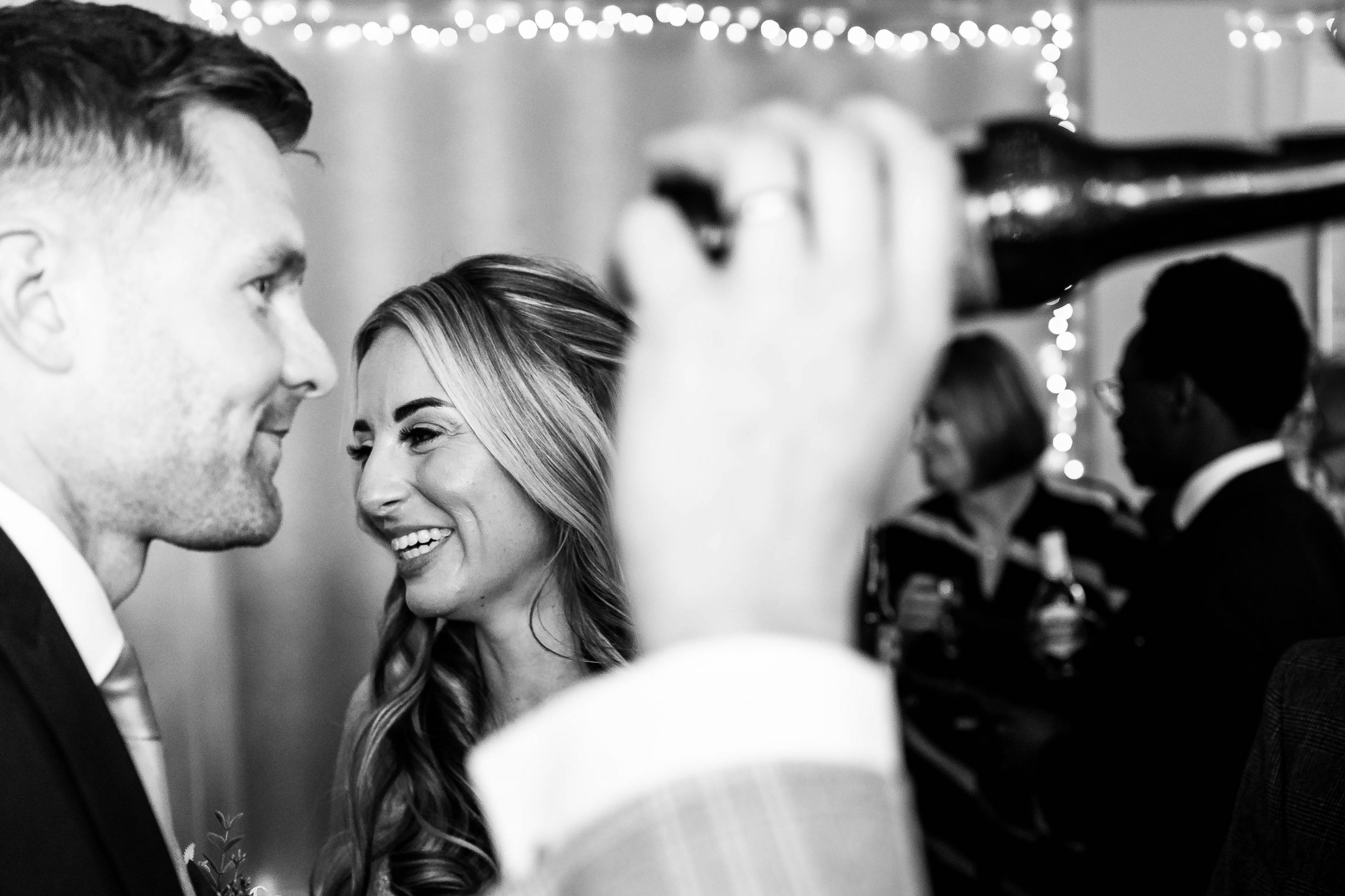 Bride shares a joke with wedding guest