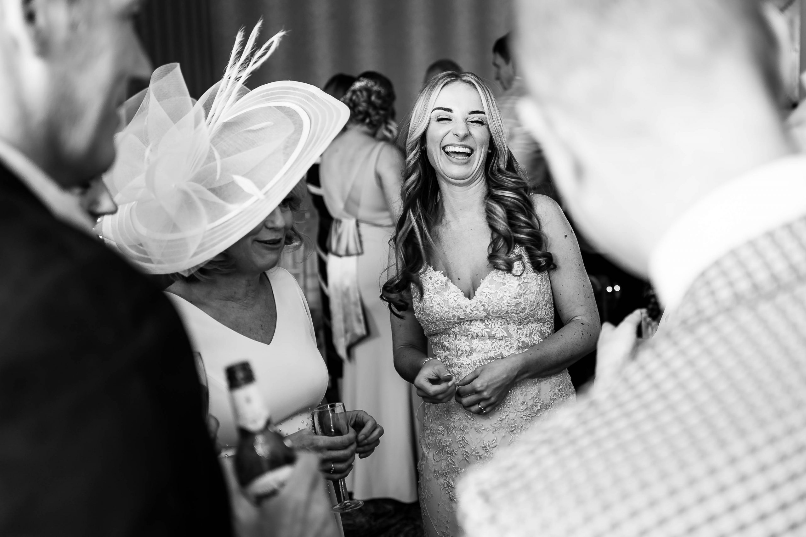 Bride jokes with wedding guests