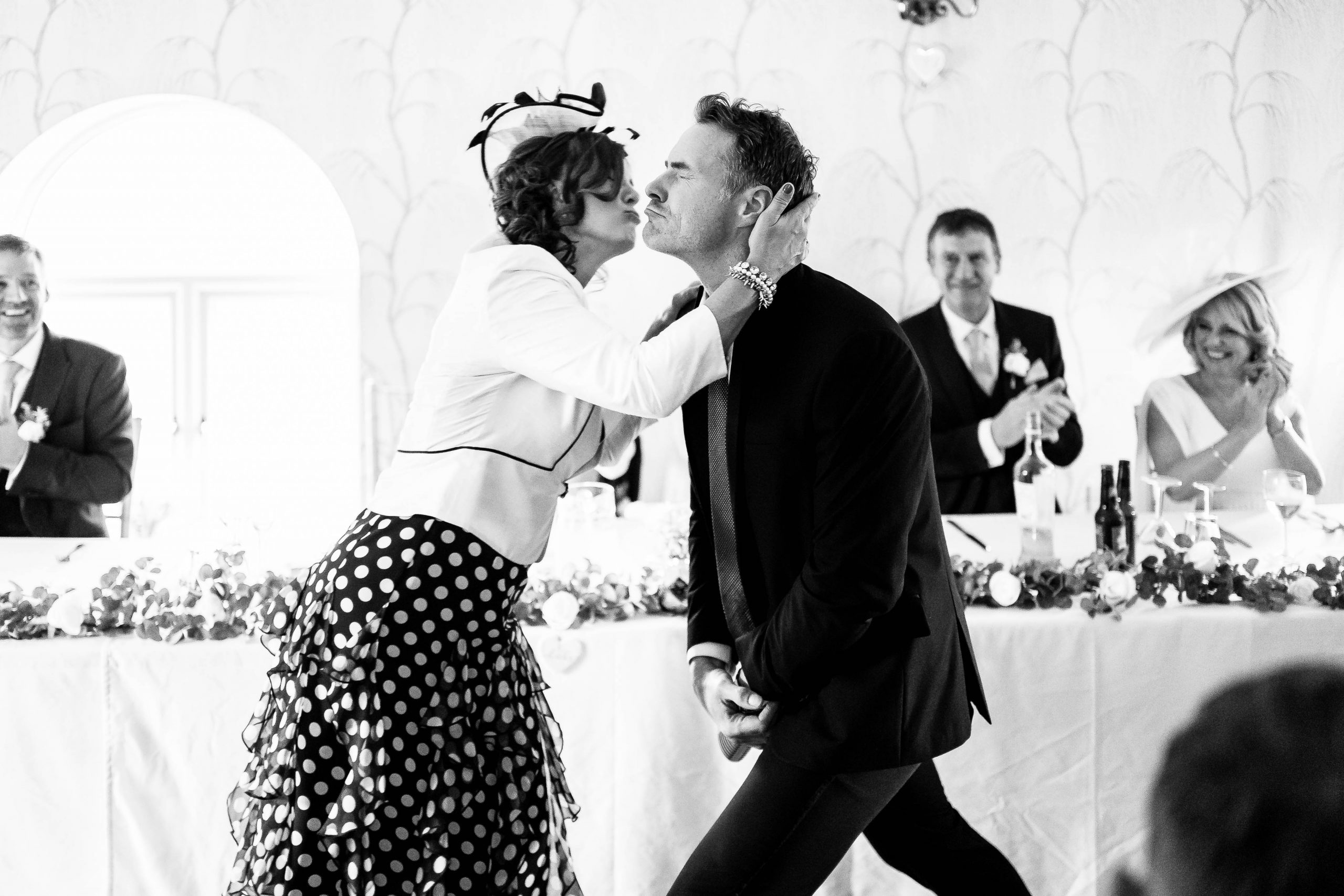 Mother of the goom 'kisses' the wedding singer