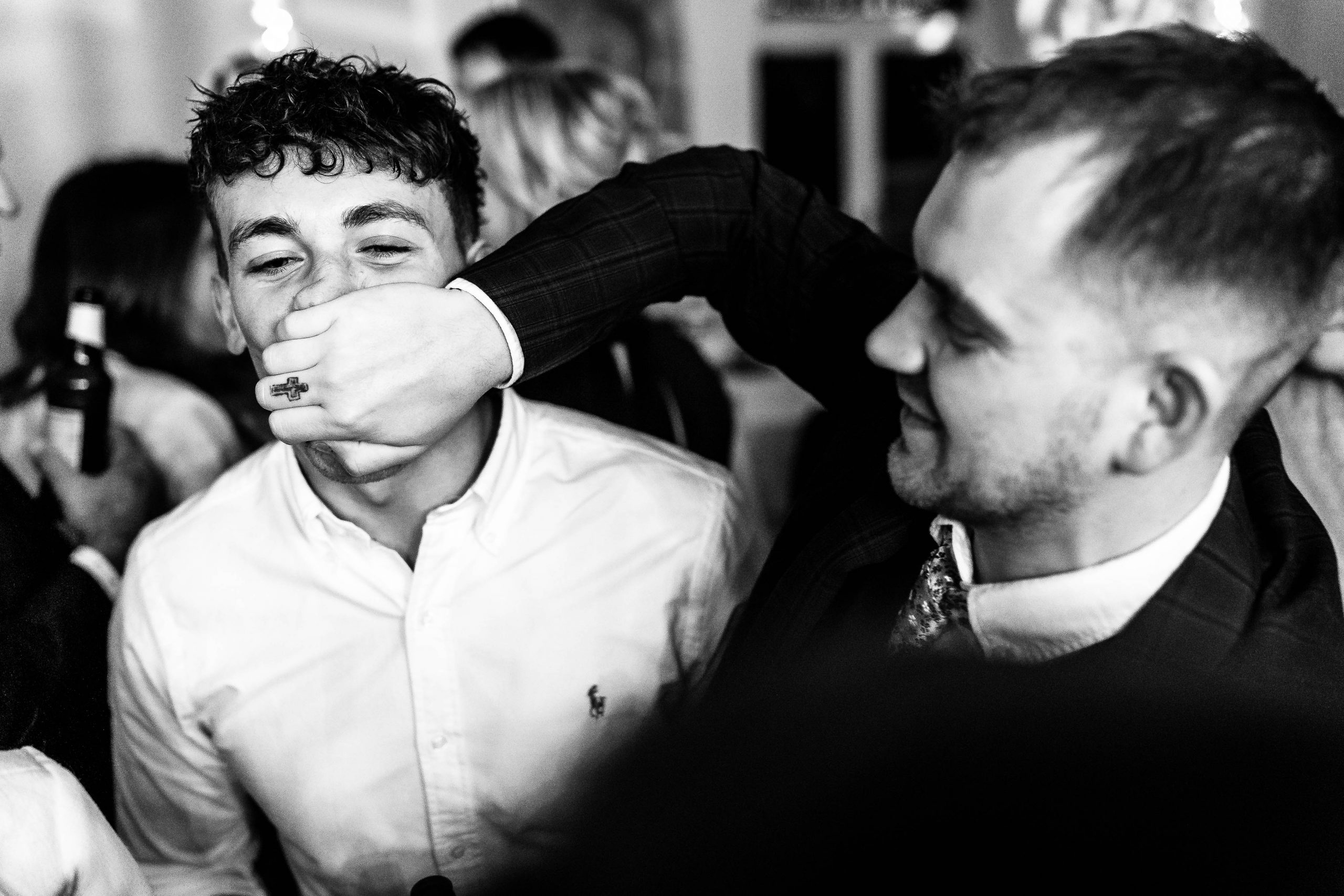 Wedding guests share a joke