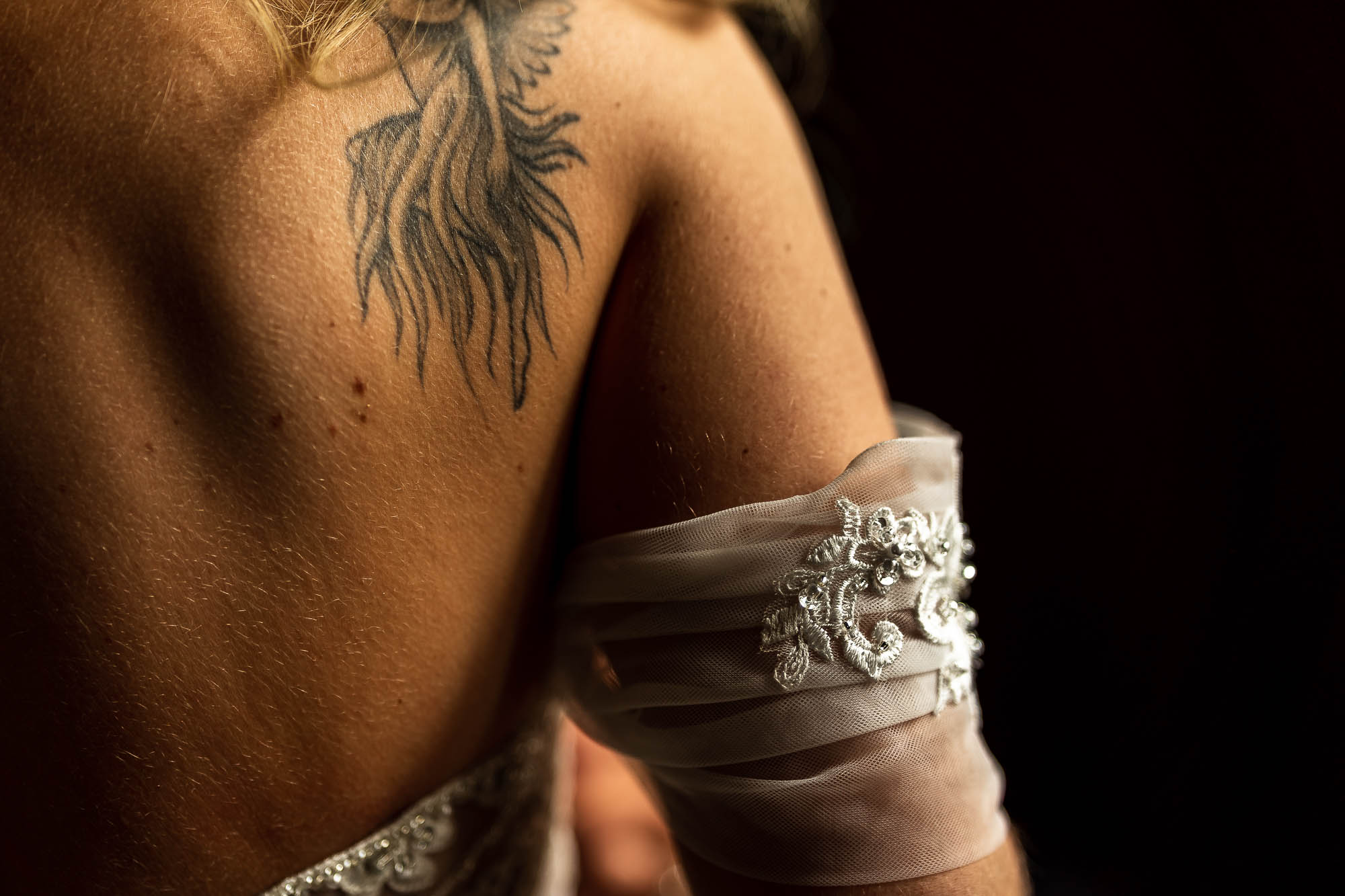 Brides tattoo on shoulder