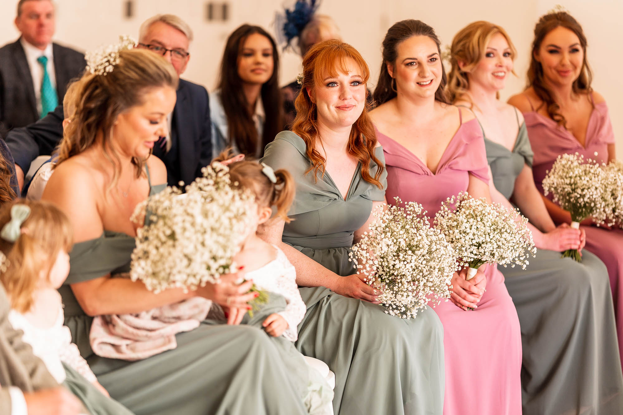 Bridesmaids watch the ceremony