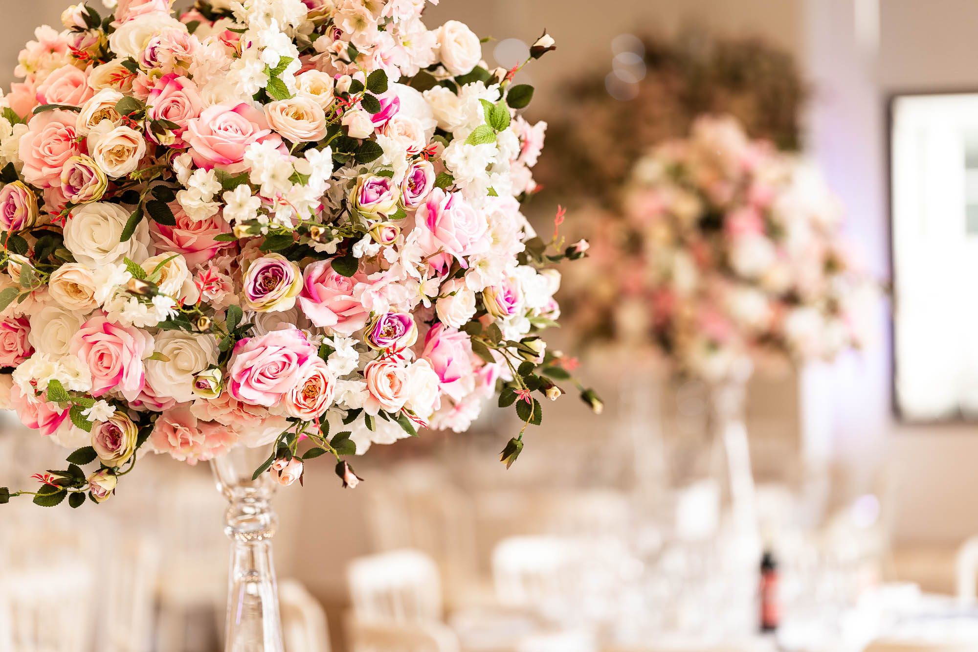 Table flowers in wedding breakfast room