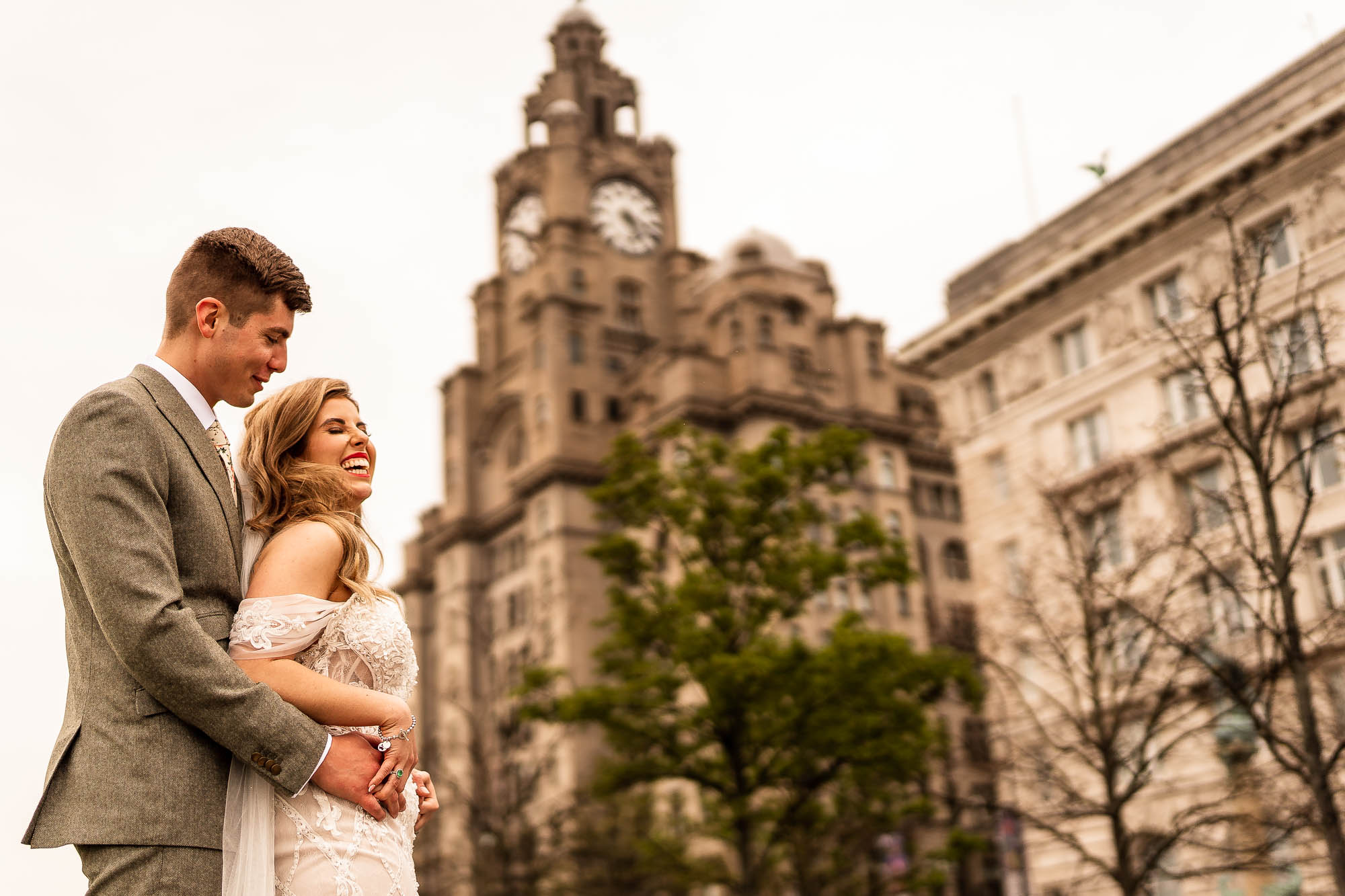 Bride and groom portrait in front of Liver building