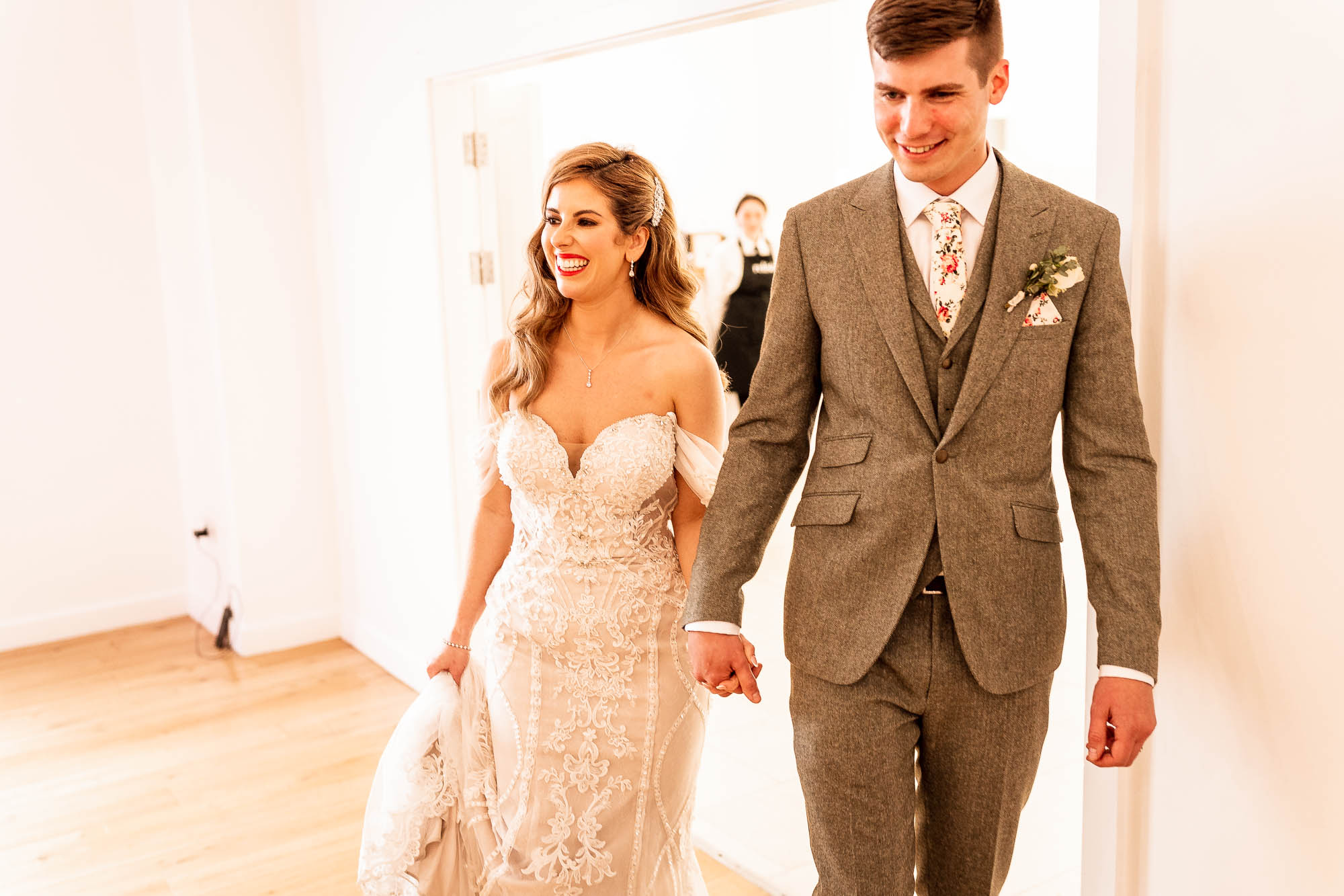 Bride and groom enter the wedding breakfast