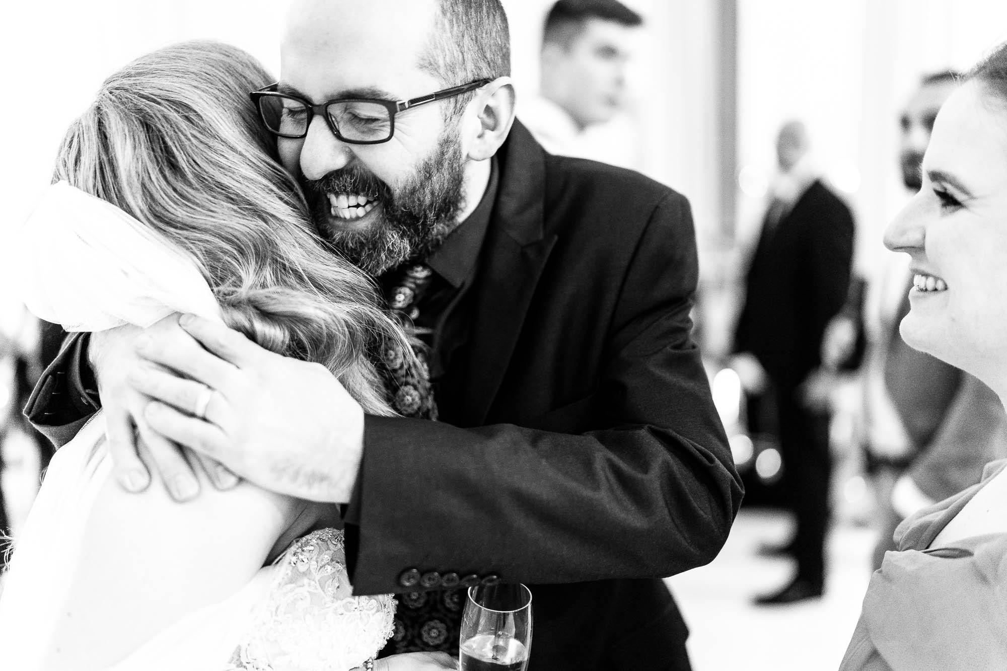 Guest hugs bride