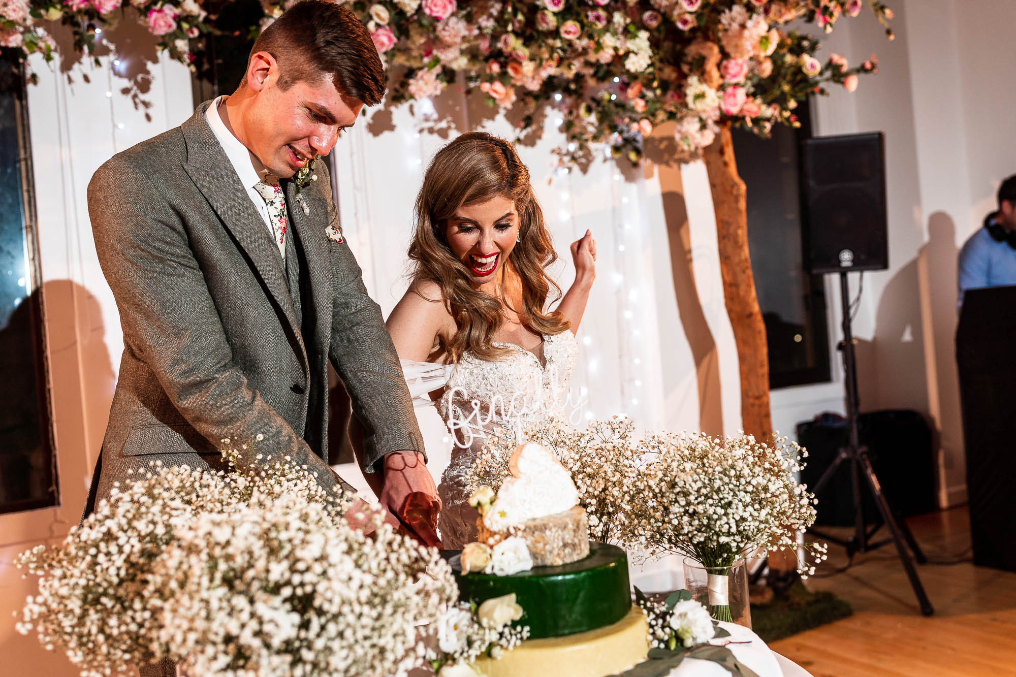Bride and groom cut the wedding cake