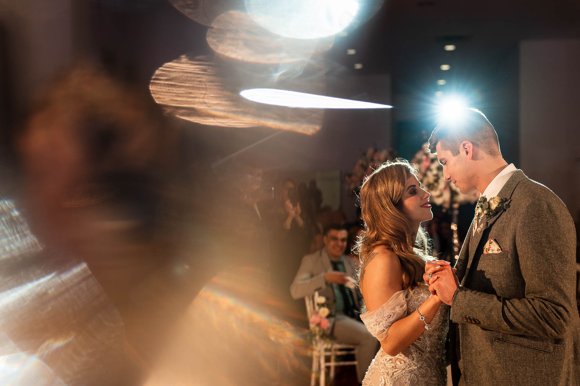 Bride and groom stare into each others eyes during first dance