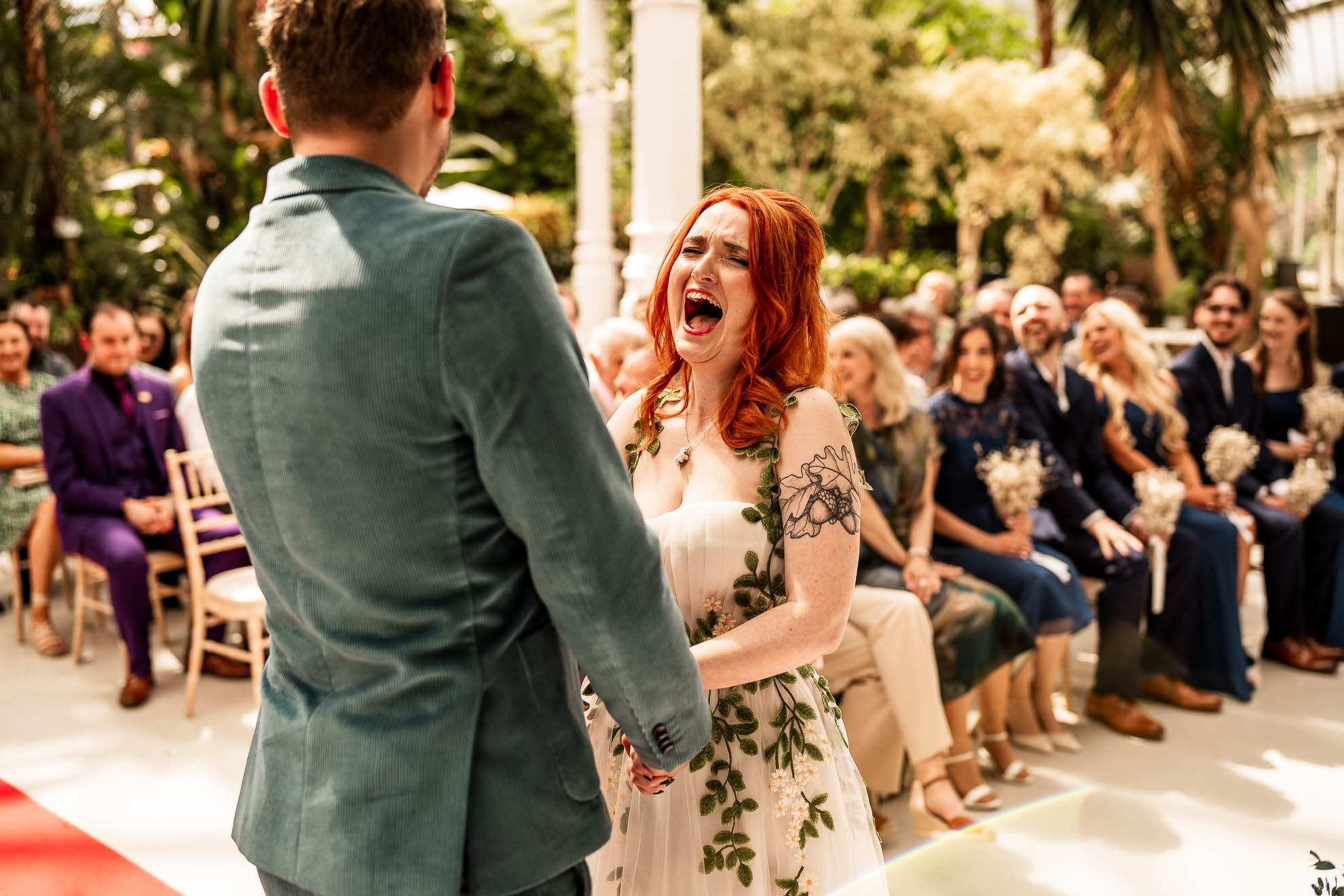 Bride laughs at grooms joke