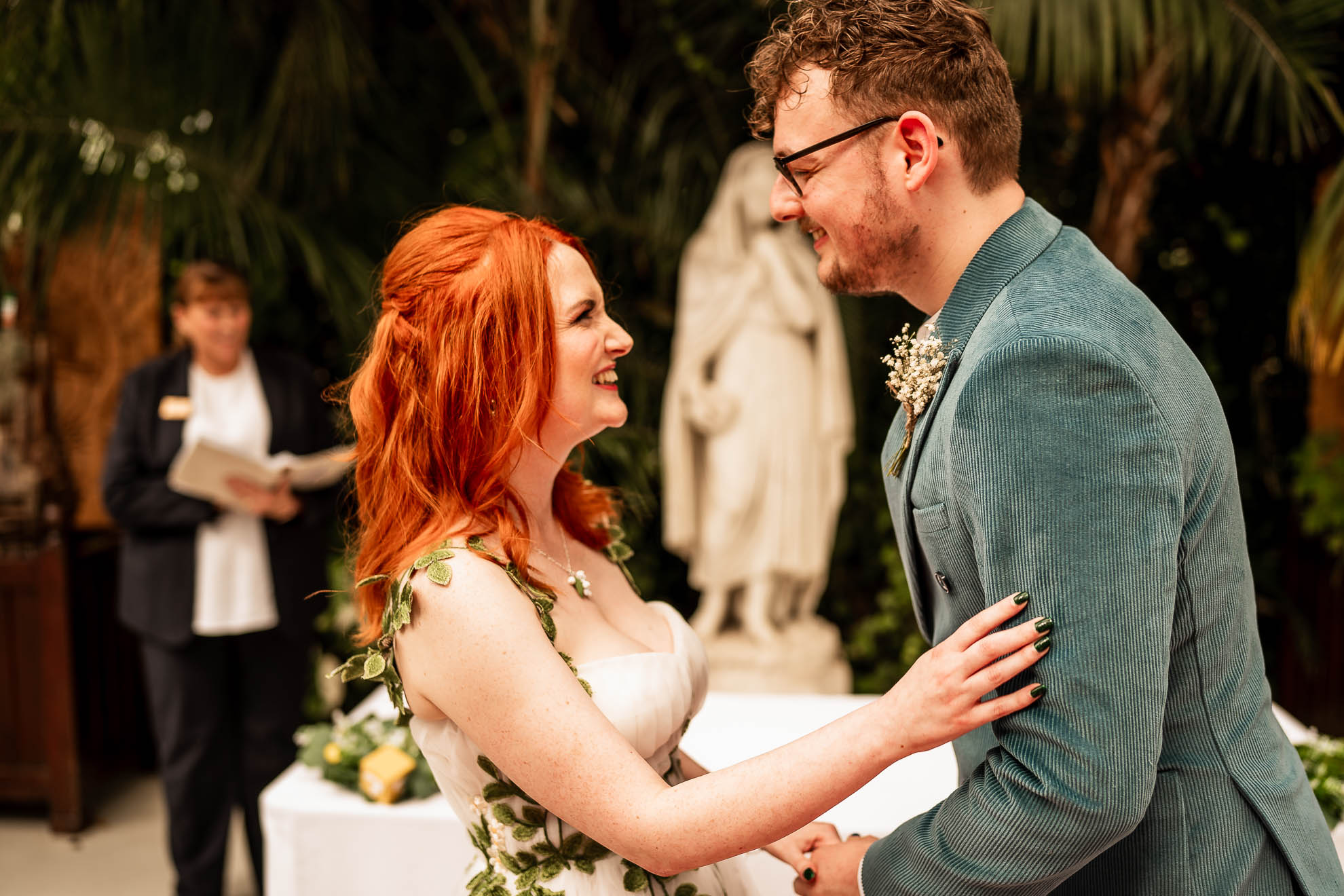 Bride and groom share a look after the exchange of rings