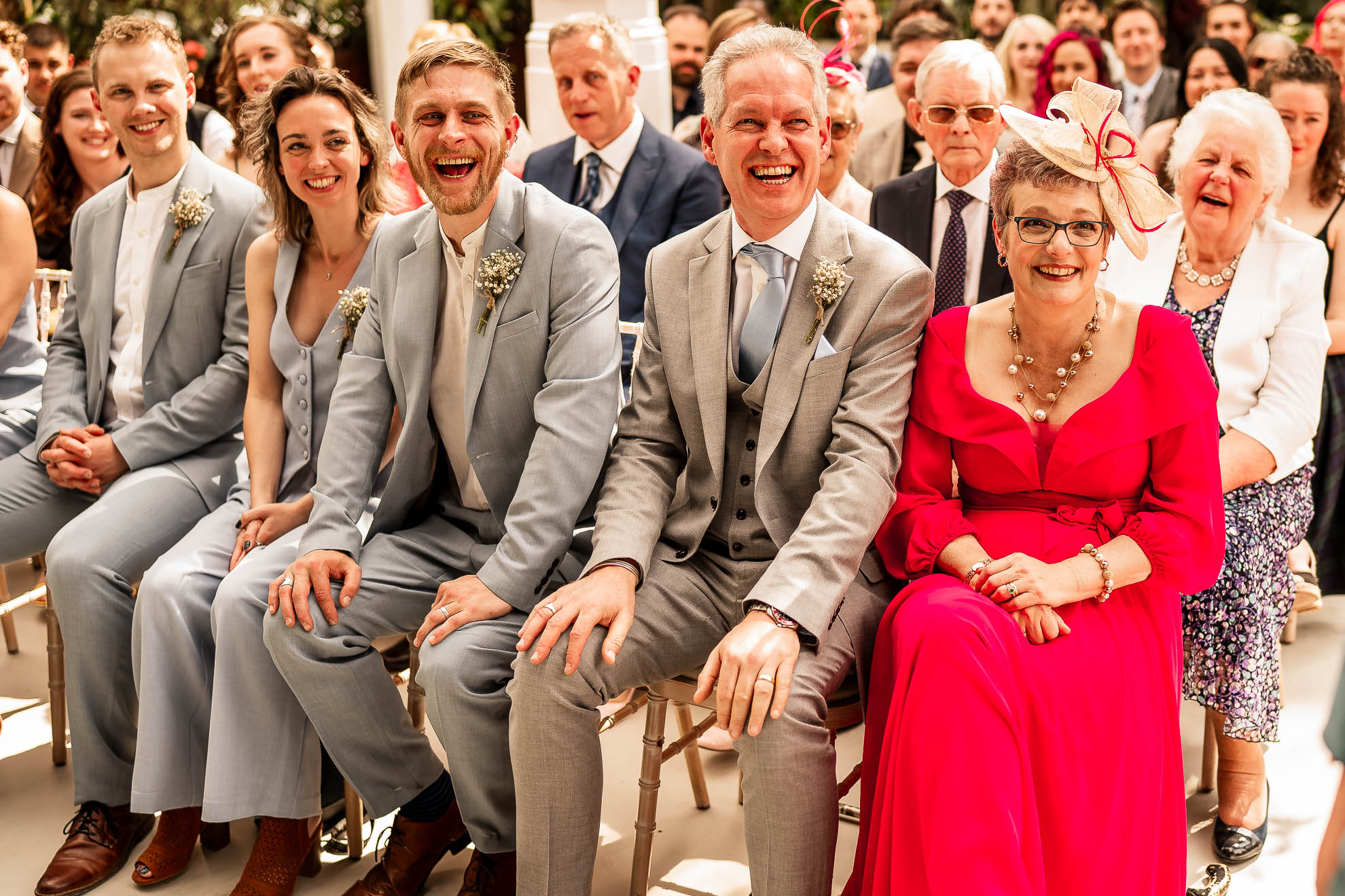 Groomsmen and bridesmaids sharing a joke