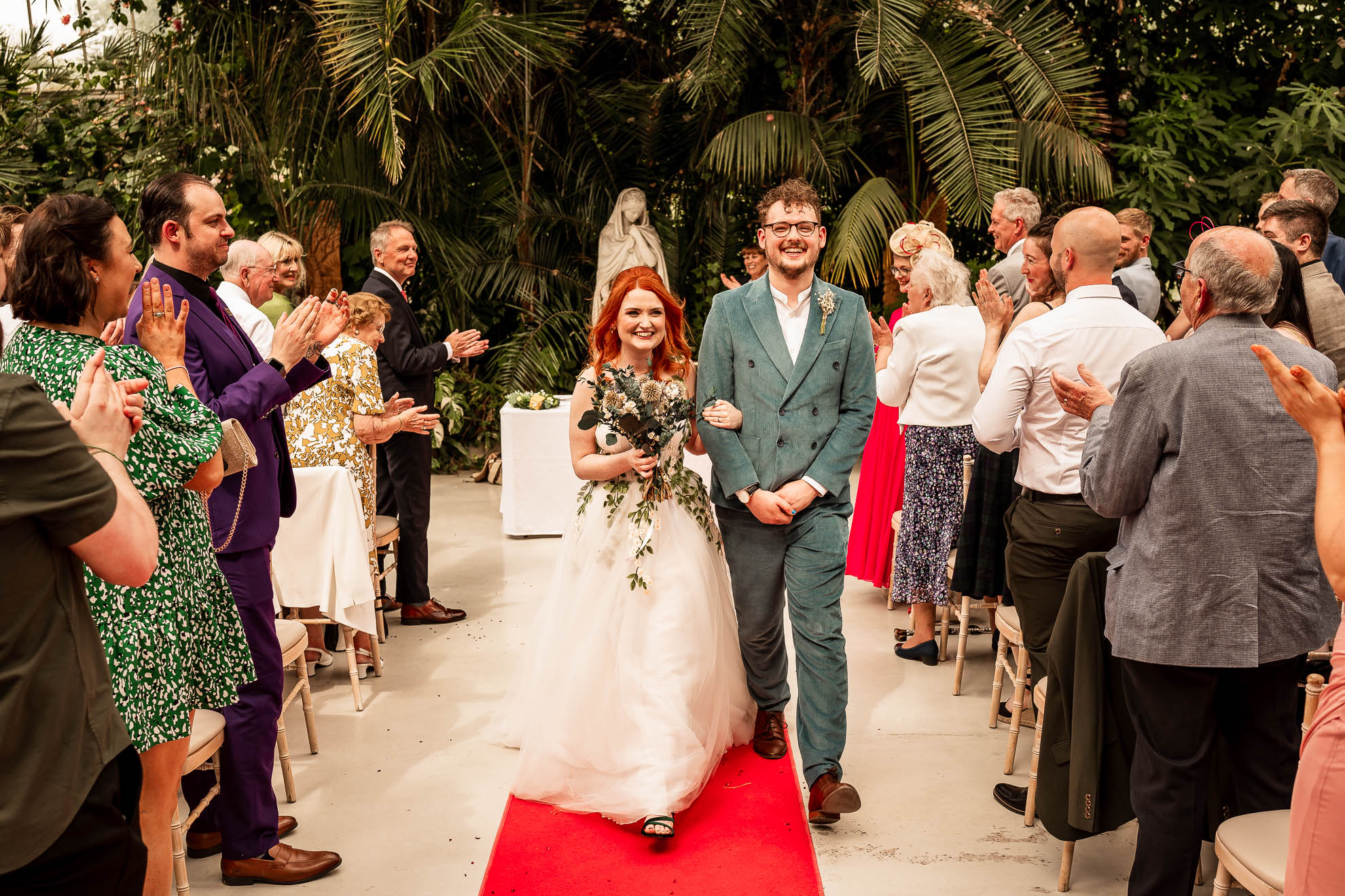 Bride and groom newlywed walk back down the aisle