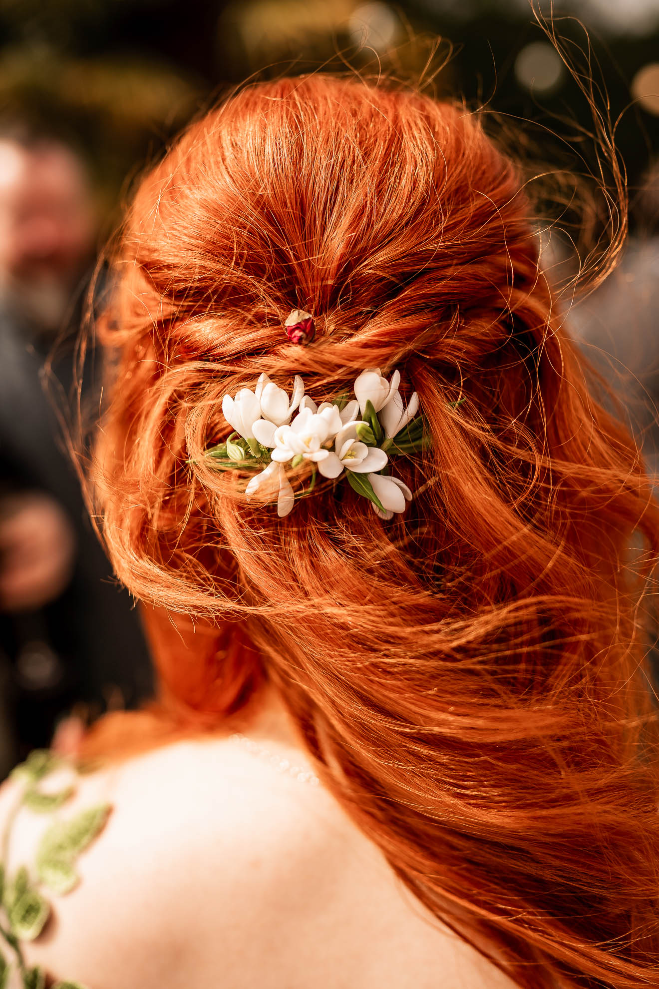 close up of flowers in brides hair