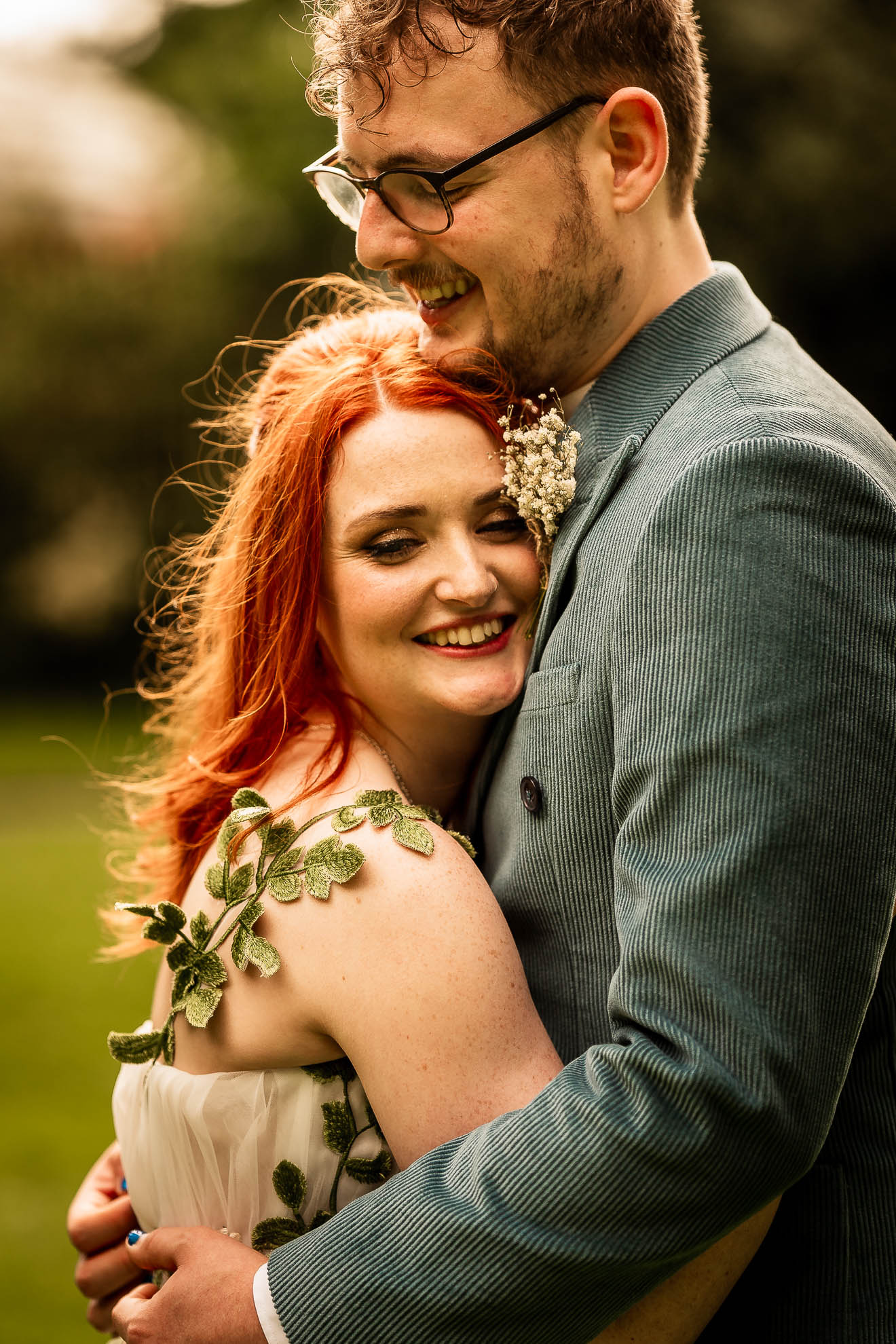 bride holds har head against grooms chest