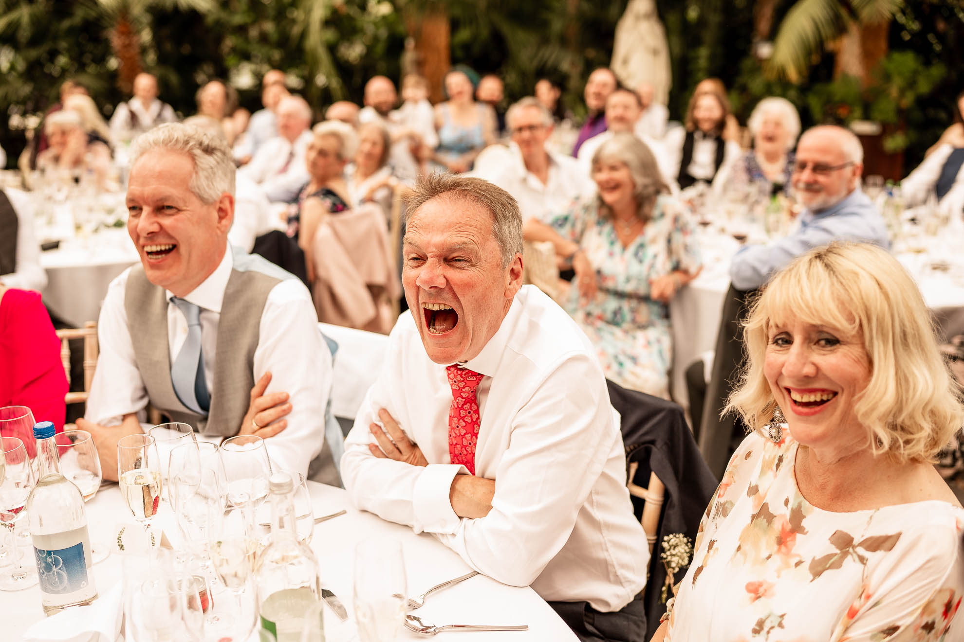 Father of the bride laughing at grooms speech
