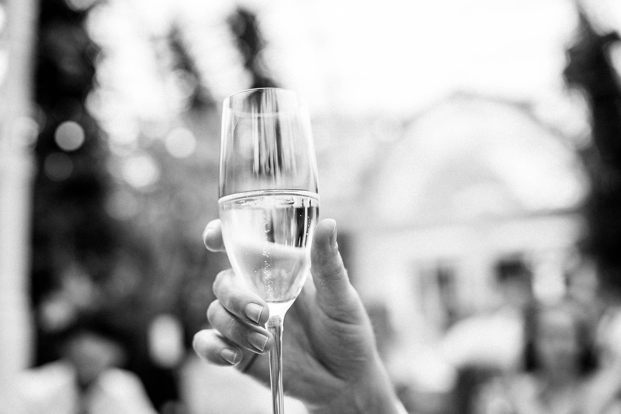close up of guests champagne glass during the toast