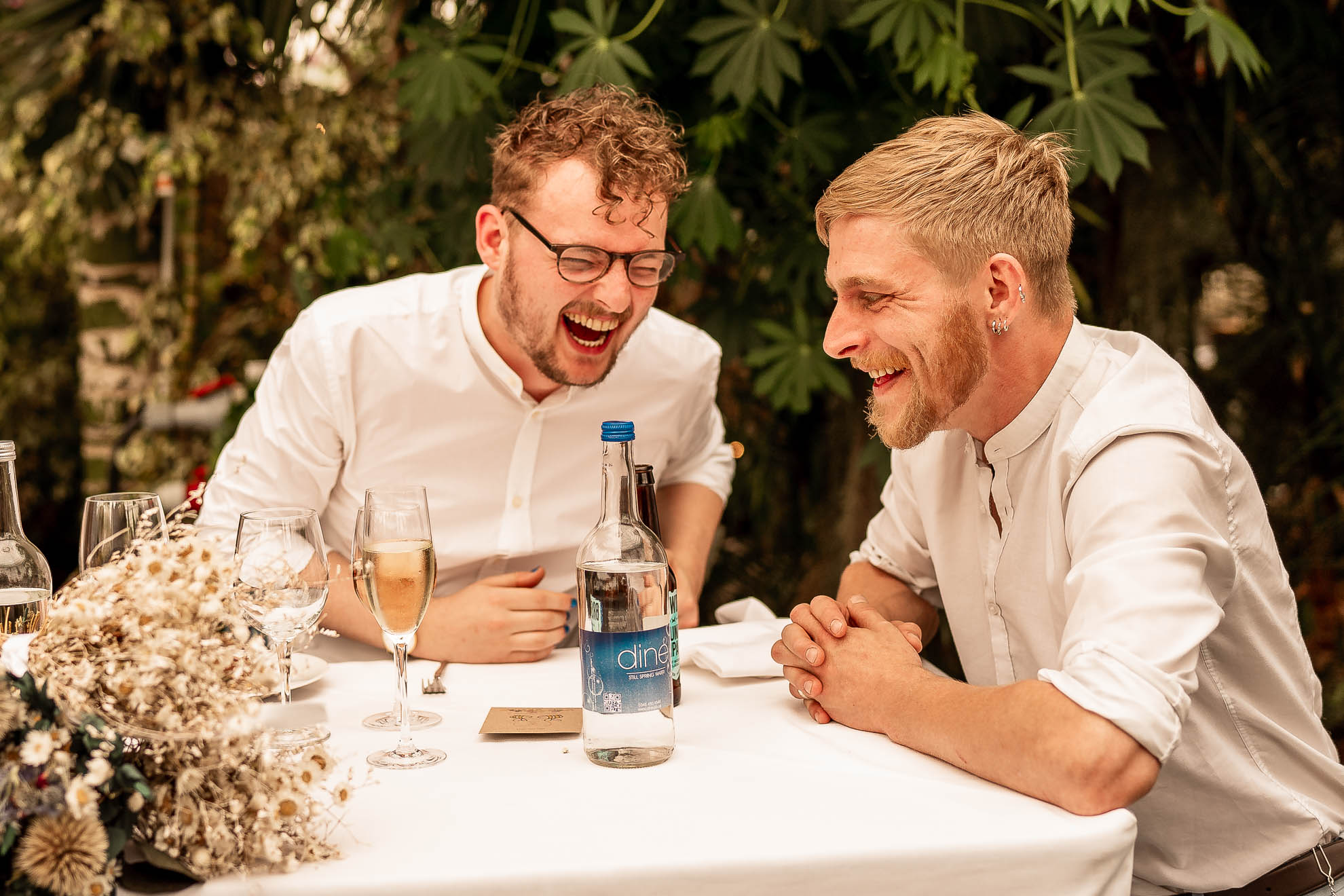 Best man and groom share a joke