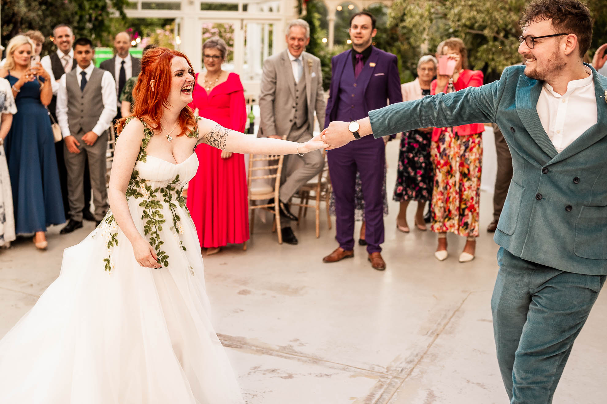Bride and groom pull apart during first dance