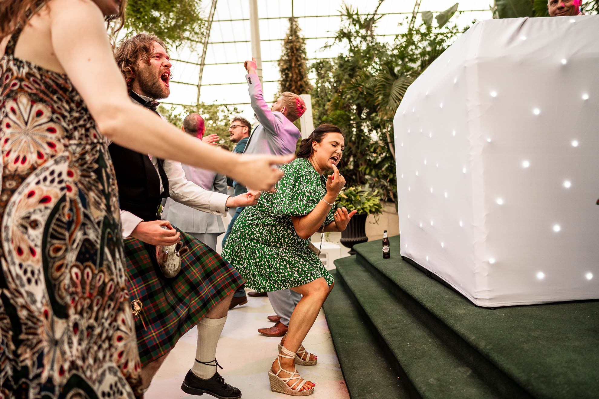 guests do air guitar during first dance