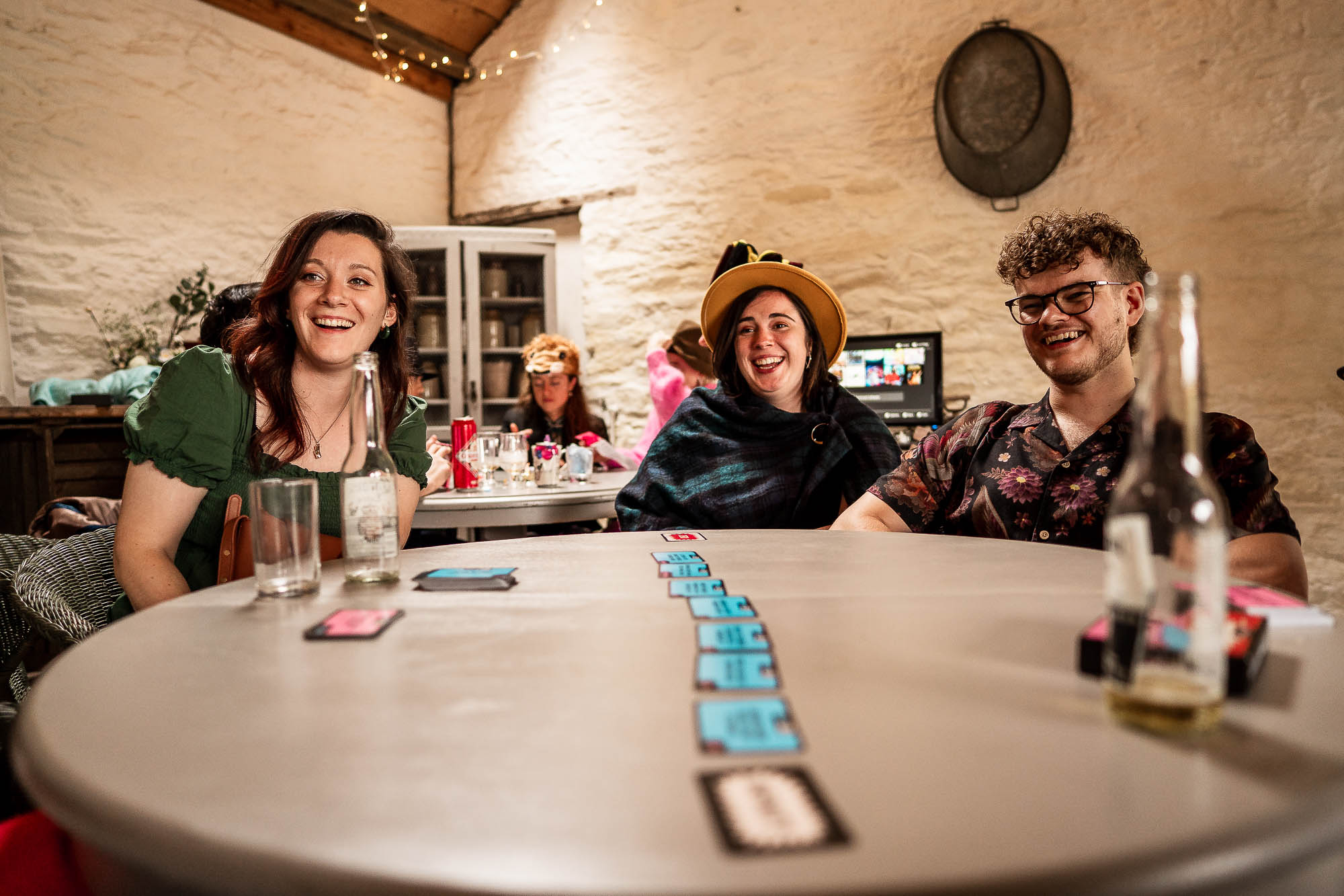 Guests laughing together during relaxed wedding reception at Wonwood Barton
