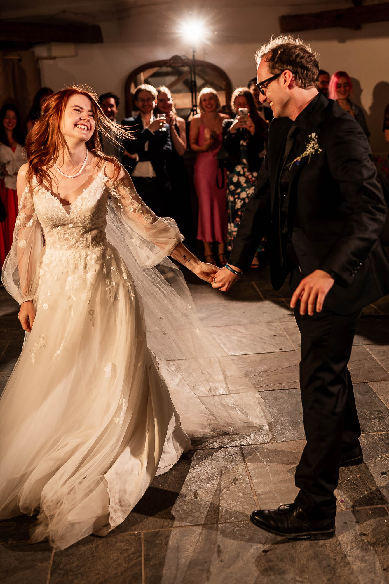 Bride and groom spinning during first dance at Wonwood Barton wedding reception