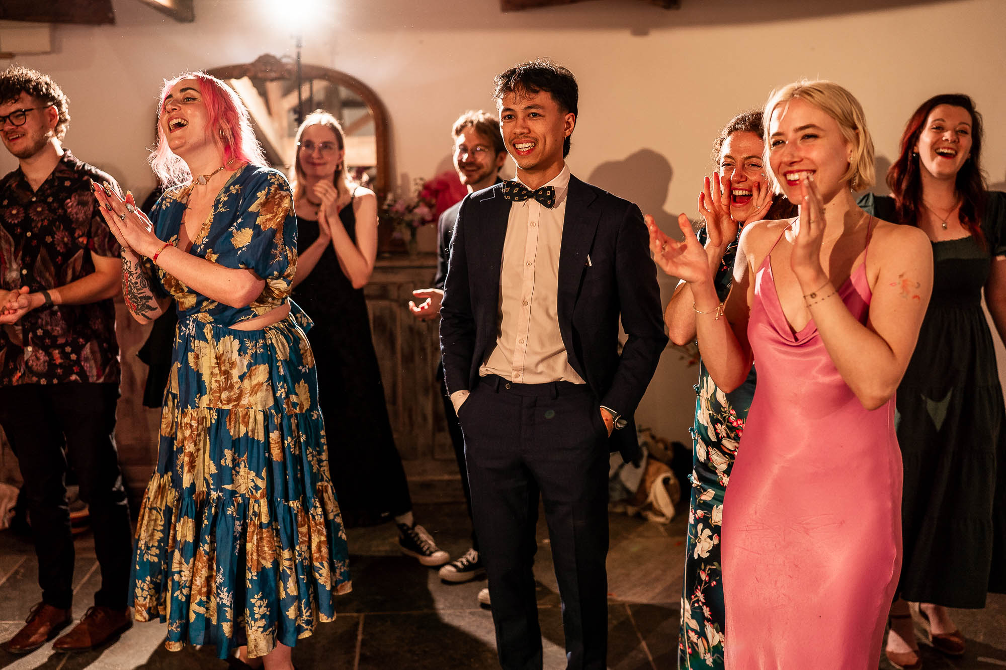 Wedding guests clapping and cheering during first dance at Wonwood Barton
