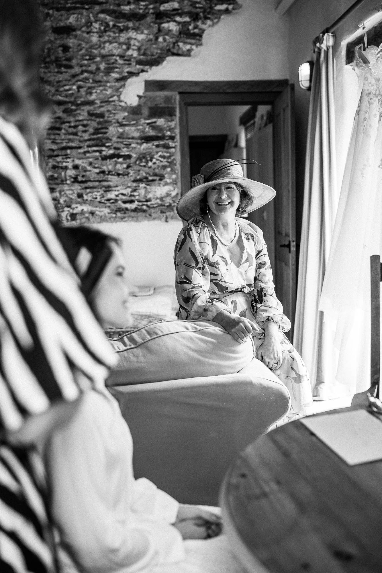 Mother of the bride smiling during morning preparations at Wonwood Barton