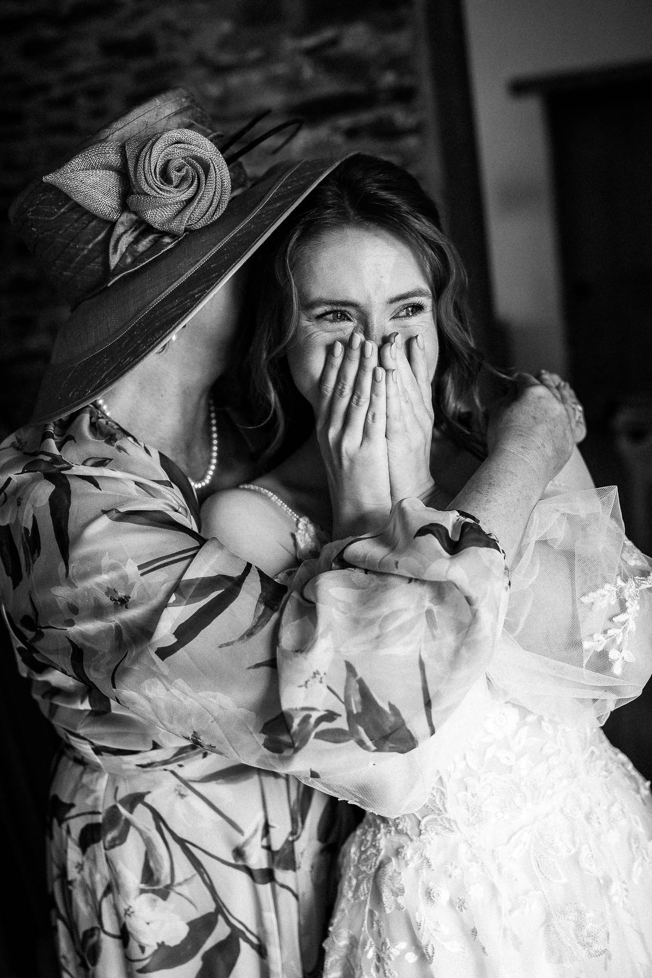 Mother hugging bride during intimate getting ready moments at Wonwood Barton wedding