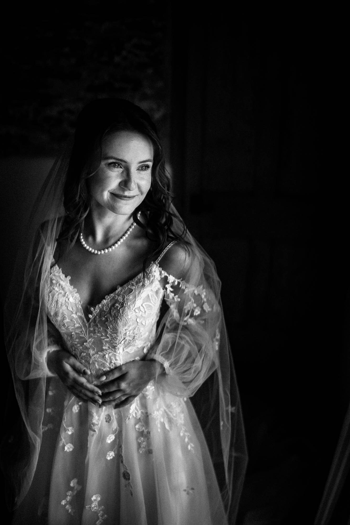 Moody bridal portrait by window light at Wonwood Barton wedding venue