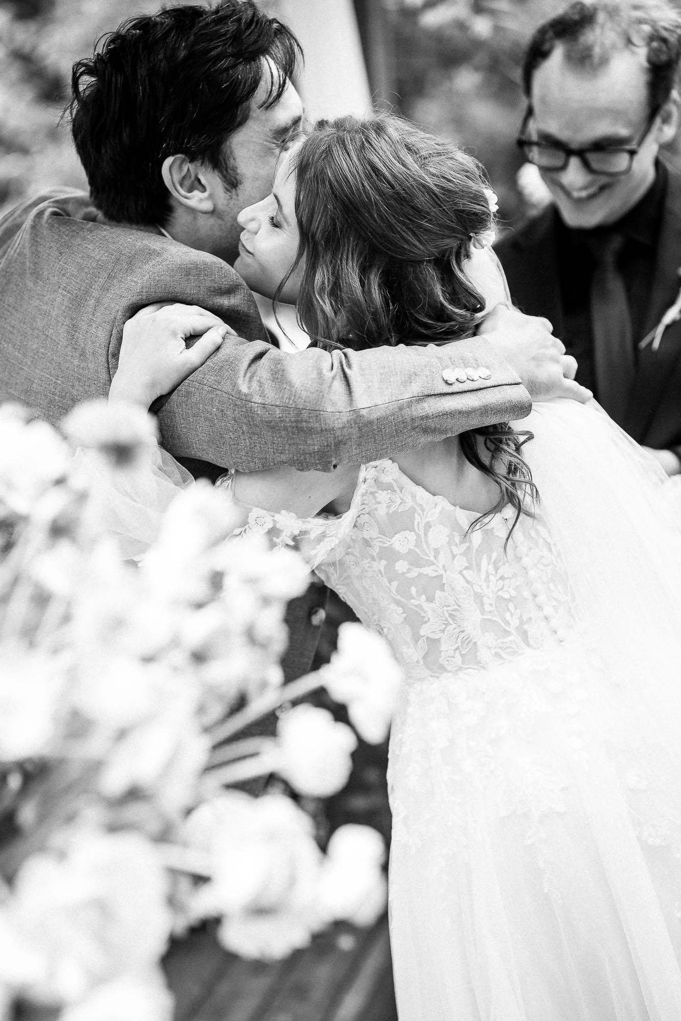 Bride hugging guest after ceremony at Wonwood Barton wedding reception
