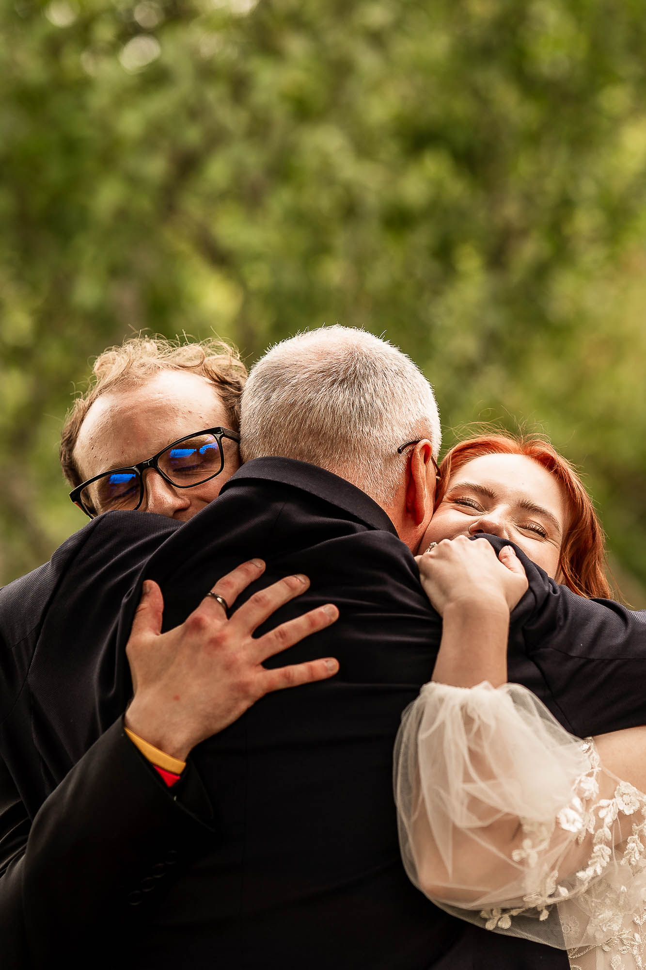 Bride hugging father after ceremony at Wonwood Barton Devon wedding